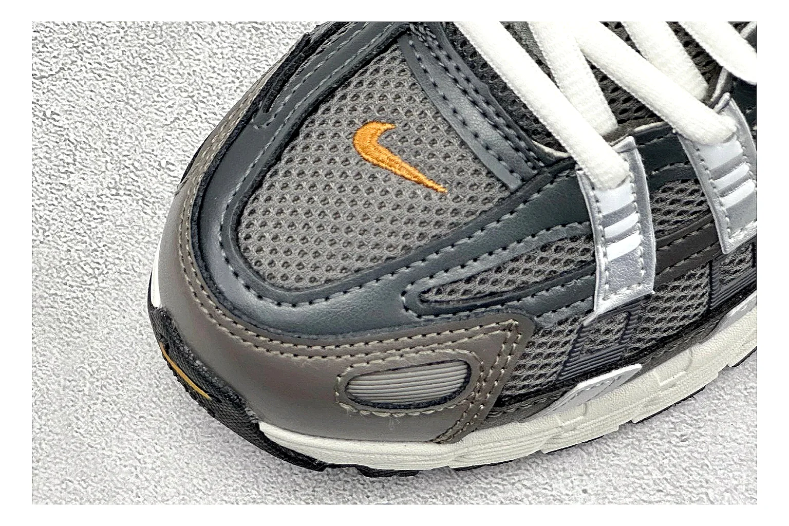 Nike P-6000 Black Orange comparison photo showing black layered runner upper, orange accent hits, retro P-6000 paneling, and cushioned casual sole thumbnail 5