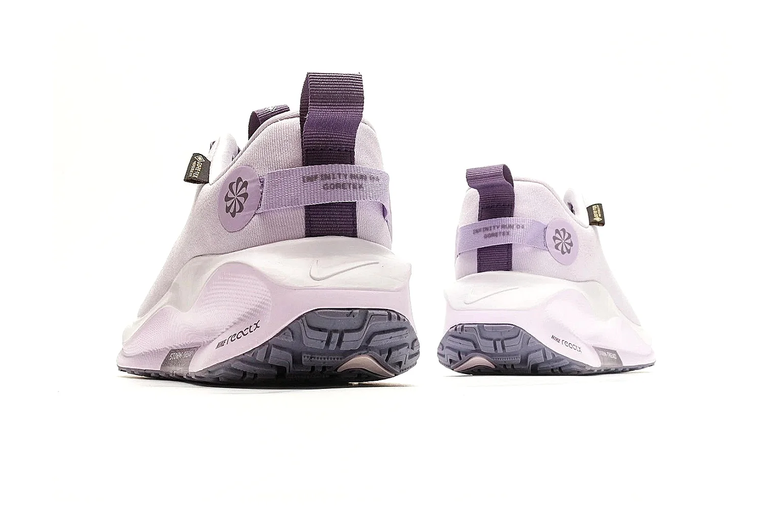 Nike ReactX GORE-TEX Lilac Sneakers comparison photo showing lilac textile upper, small Swoosh, heel pull tabs, cushioned ReactX-style sole, and weather-ready low profile thumbnail 3