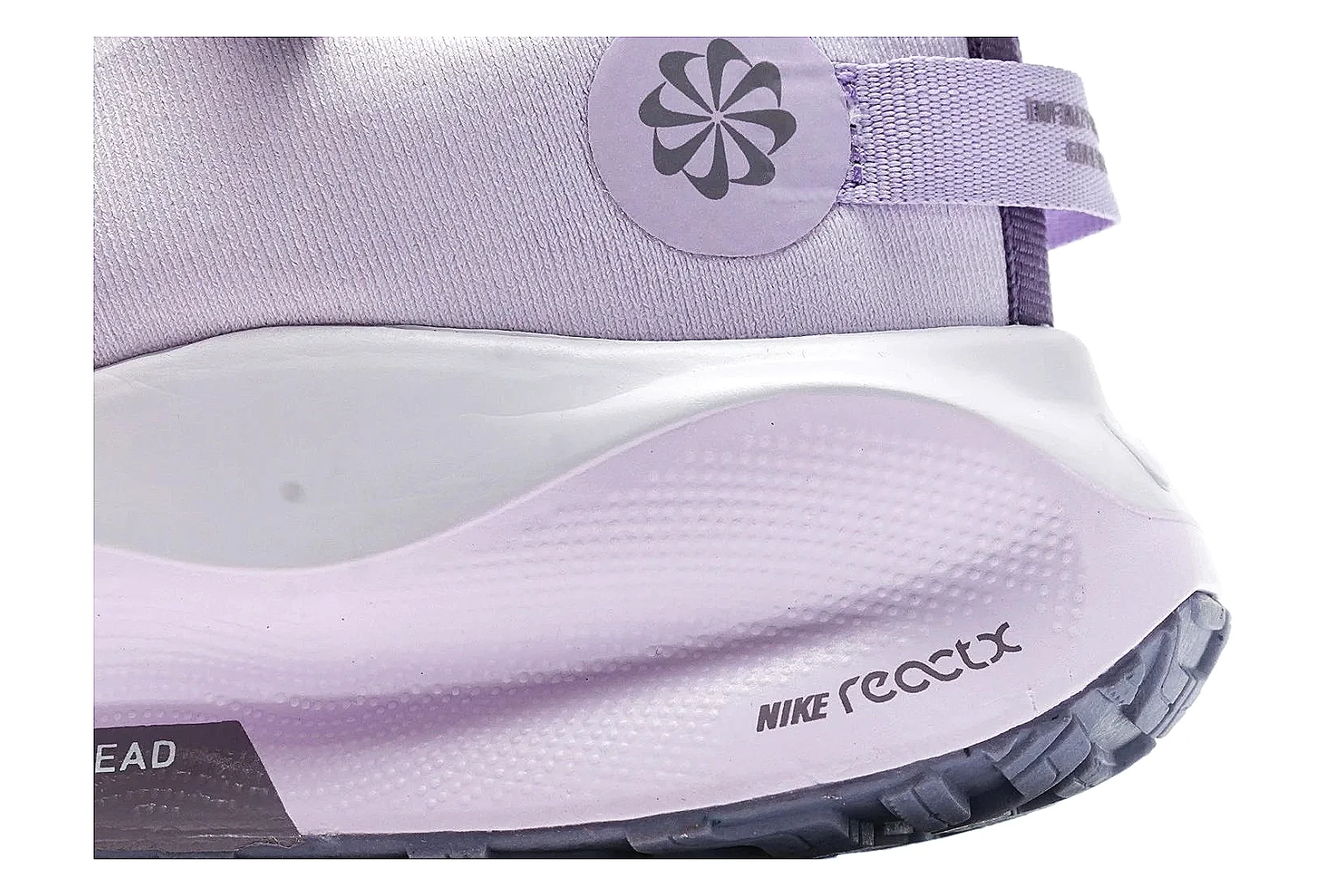 Nike ReactX GORE-TEX Lilac Sneakers comparison photo showing lilac textile upper, small Swoosh, heel pull tabs, cushioned ReactX-style sole, and weather-ready low profile thumbnail 5