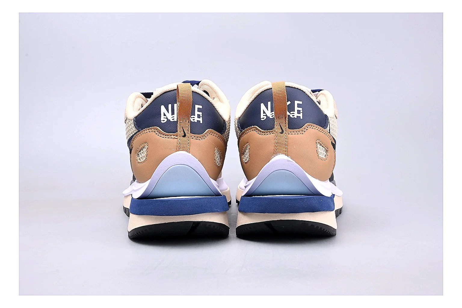 Nike Retro Runner Beige Blue comparison photo showing beige suede-mesh runner upper, blue accent panels, low retro profile, and cushioned running sole thumbnail 4