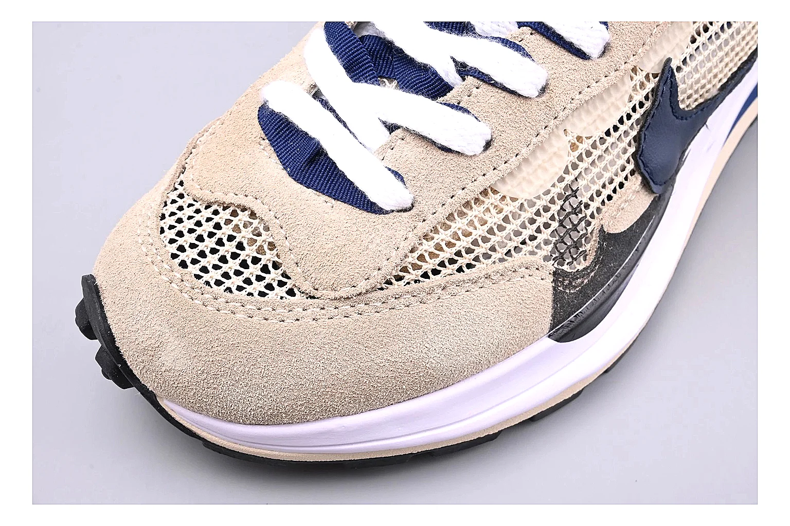 Nike Retro Runner Beige Blue comparison photo showing beige suede-mesh runner upper, blue accent panels, low retro profile, and cushioned running sole thumbnail 5