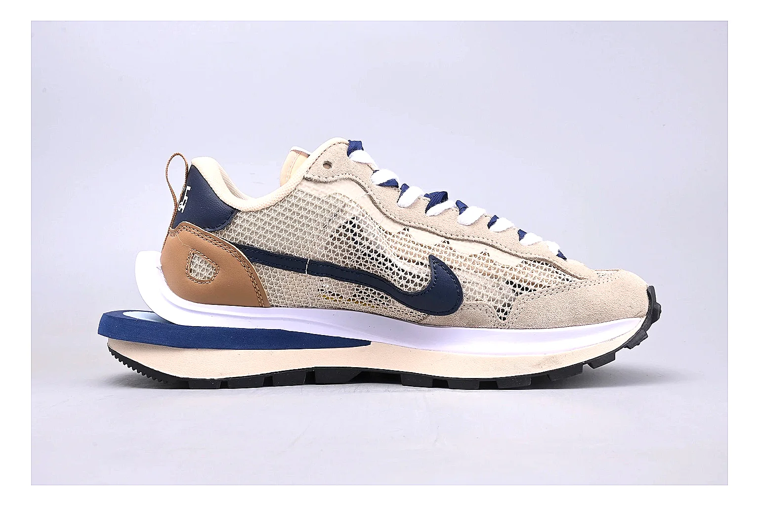 Nike Retro Runner Beige Blue comparison photo showing beige suede-mesh runner upper, blue accent panels, low retro profile, and cushioned running sole thumbnail 6