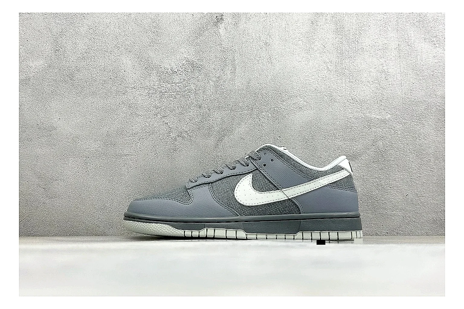 Nike SB Dunk Low Grey comparison photo showing grey low-top skate upper, white Swoosh, padded collar, and classic Dunk sole