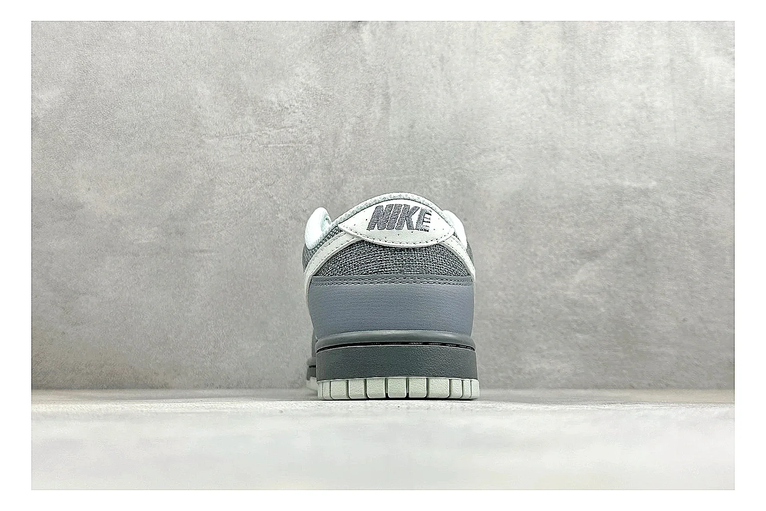 Nike SB Dunk Low Grey comparison photo showing grey low-top skate upper, white Swoosh, padded collar, and classic Dunk sole thumbnail 3