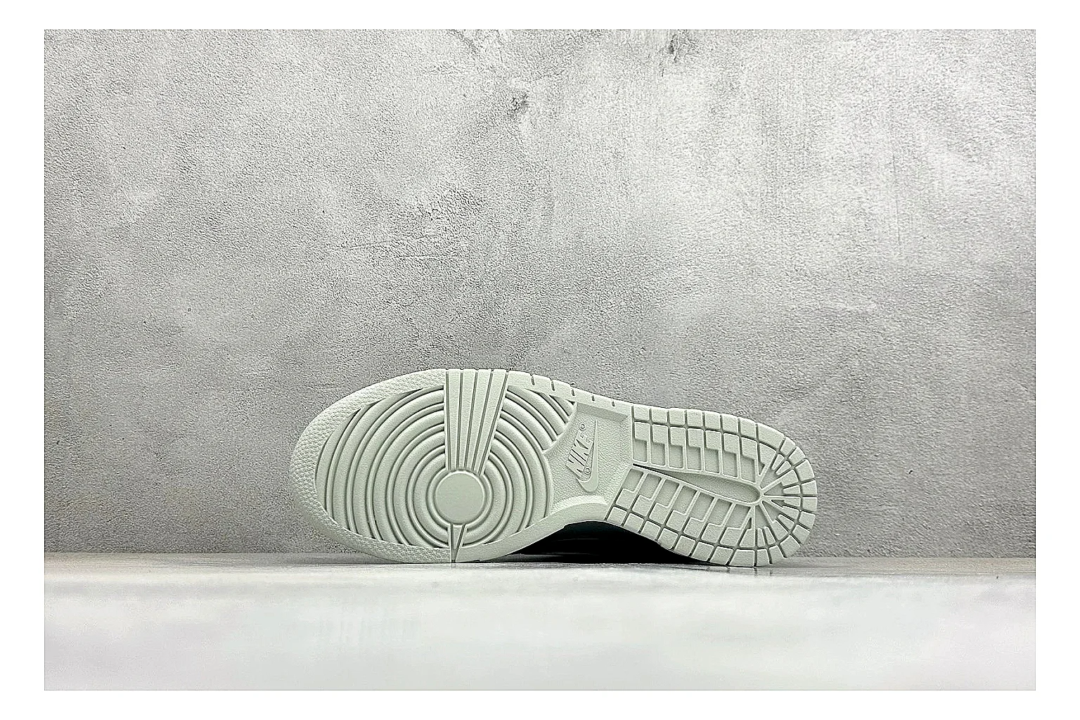 Nike SB Dunk Low Grey comparison photo showing grey low-top skate upper, white Swoosh, padded collar, and classic Dunk sole thumbnail 4