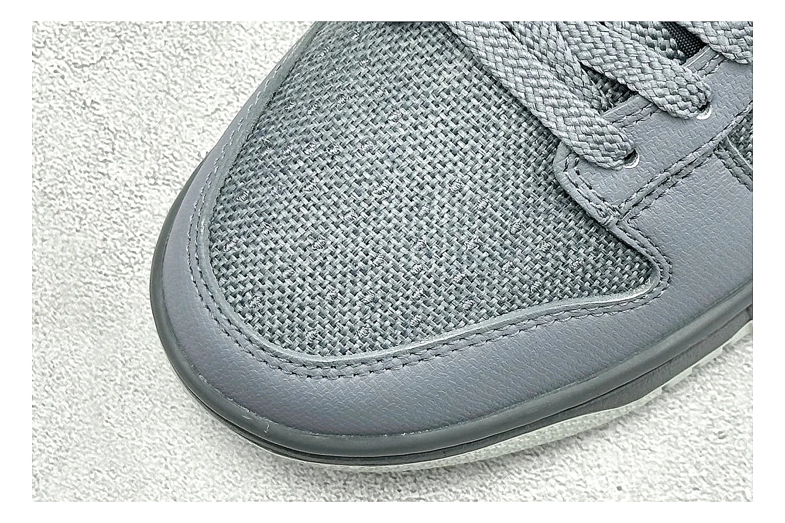Nike SB Dunk Low Grey comparison photo showing grey low-top skate upper, white Swoosh, padded collar, and classic Dunk sole thumbnail 5
