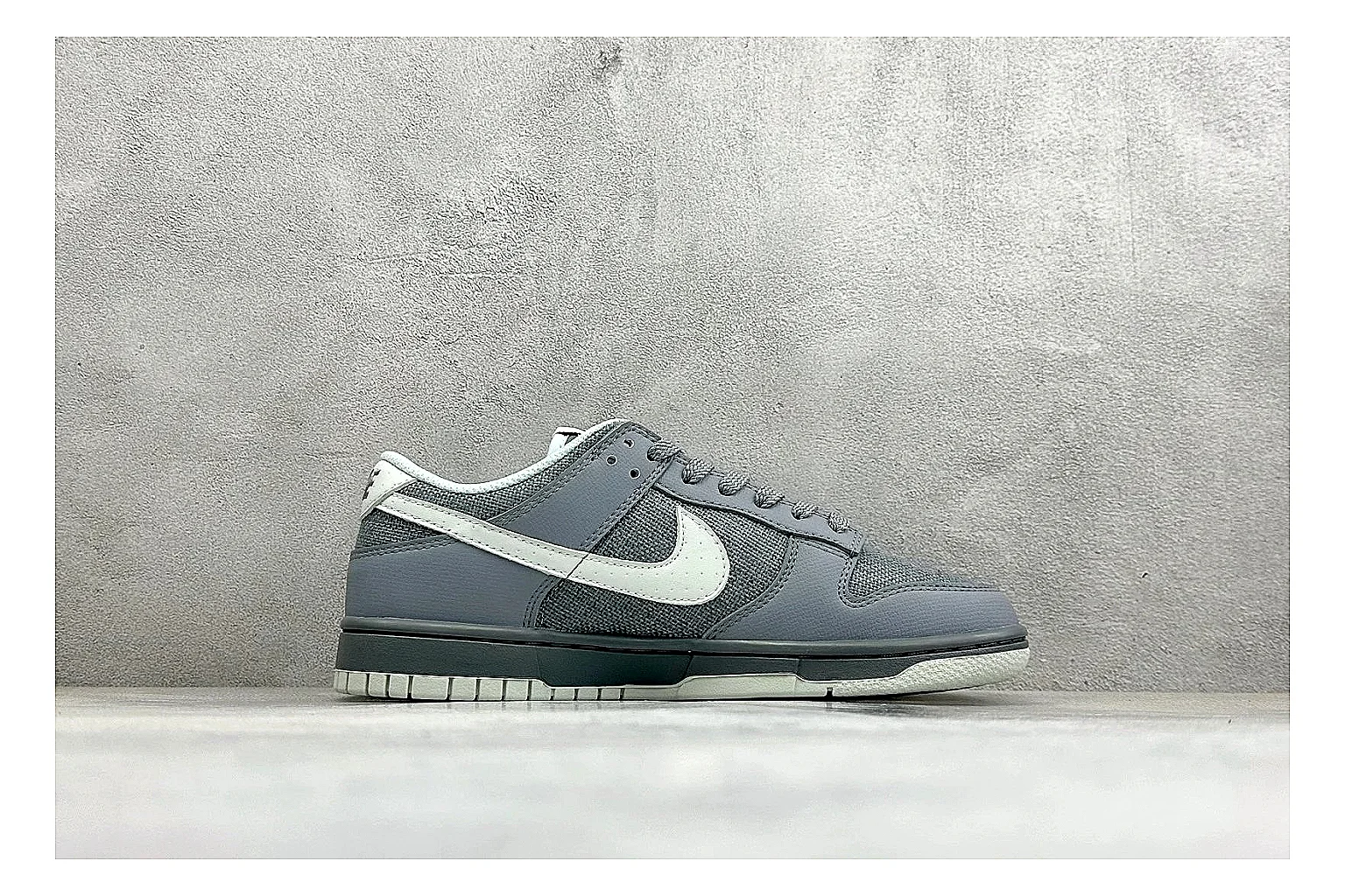 Nike SB Dunk Low Grey comparison photo showing grey low-top skate upper, white Swoosh, padded collar, and classic Dunk sole thumbnail 6