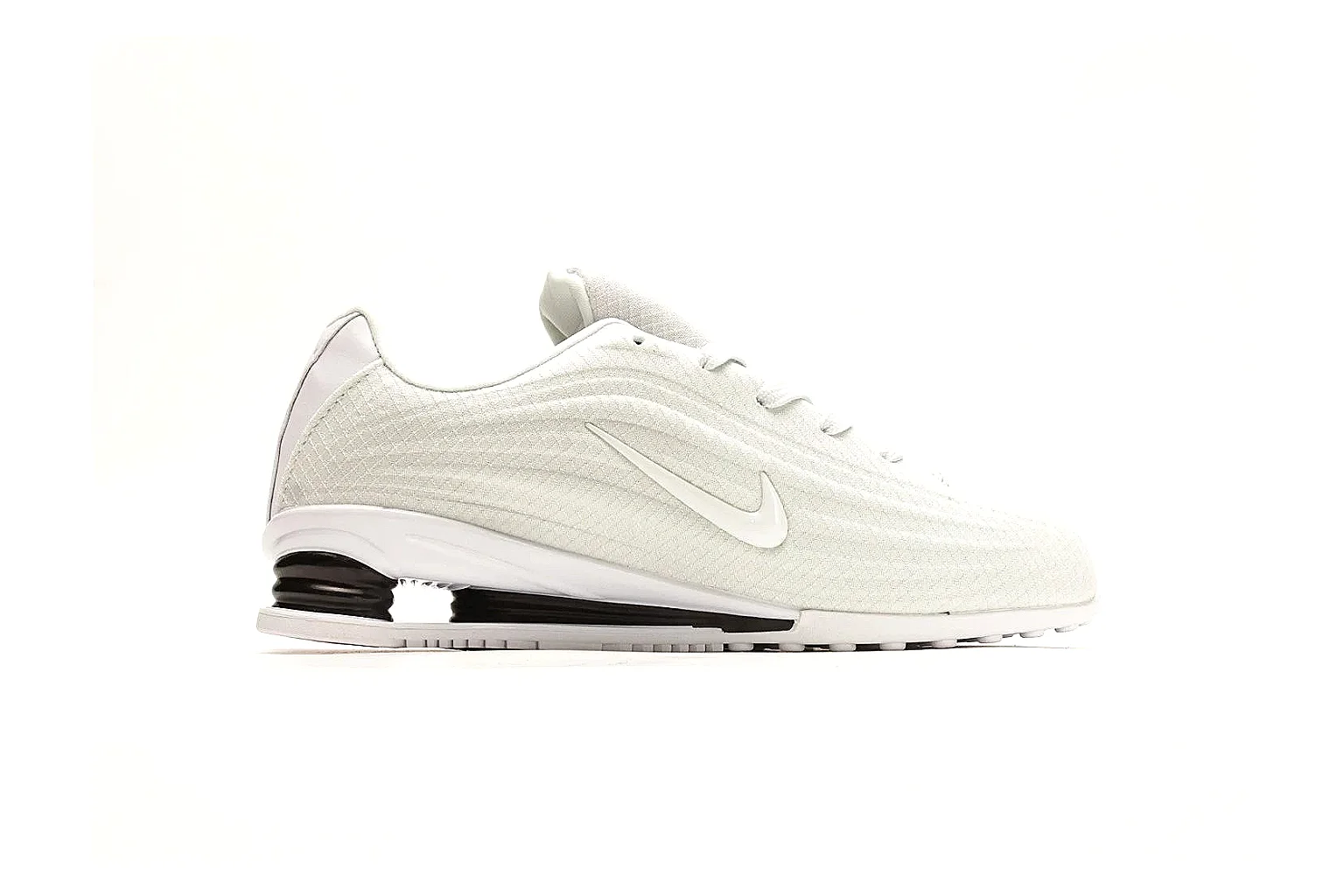 Nike Shox Z White Sneakers comparison photo showing white streamlined layered upper, small Swoosh, black heel cushioning columns, and modern low runner shape thumbnail 6