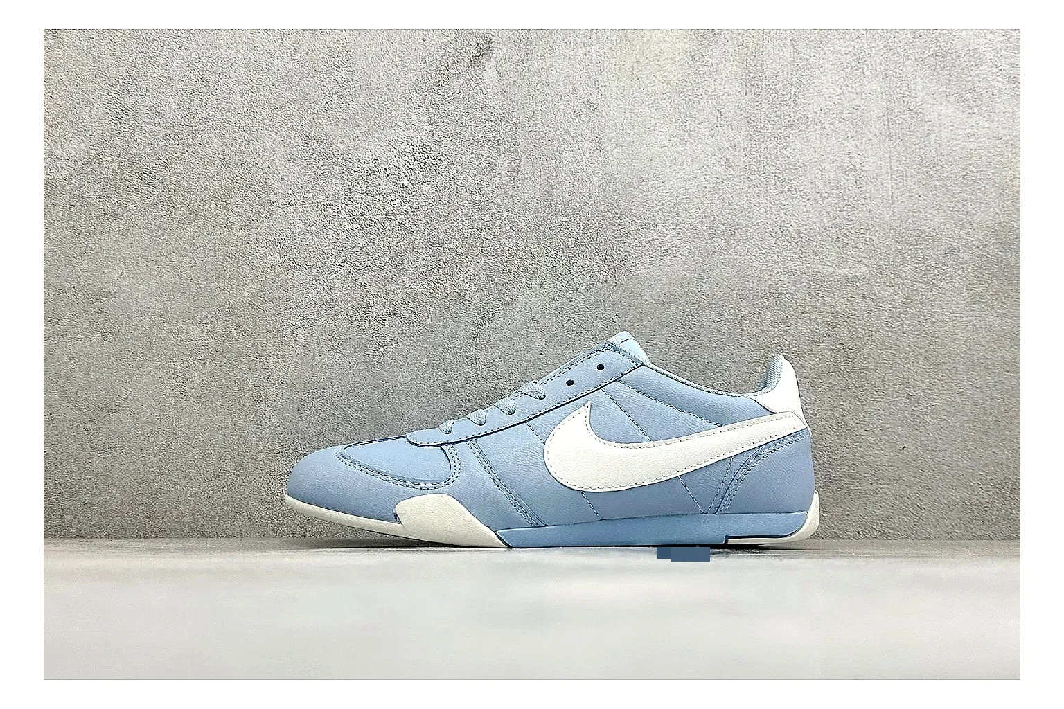 Nike Sprint Sister Light Blue comparison photo showing light blue retro-runner upper, slim side profile, tonal panels, and low everyday sole