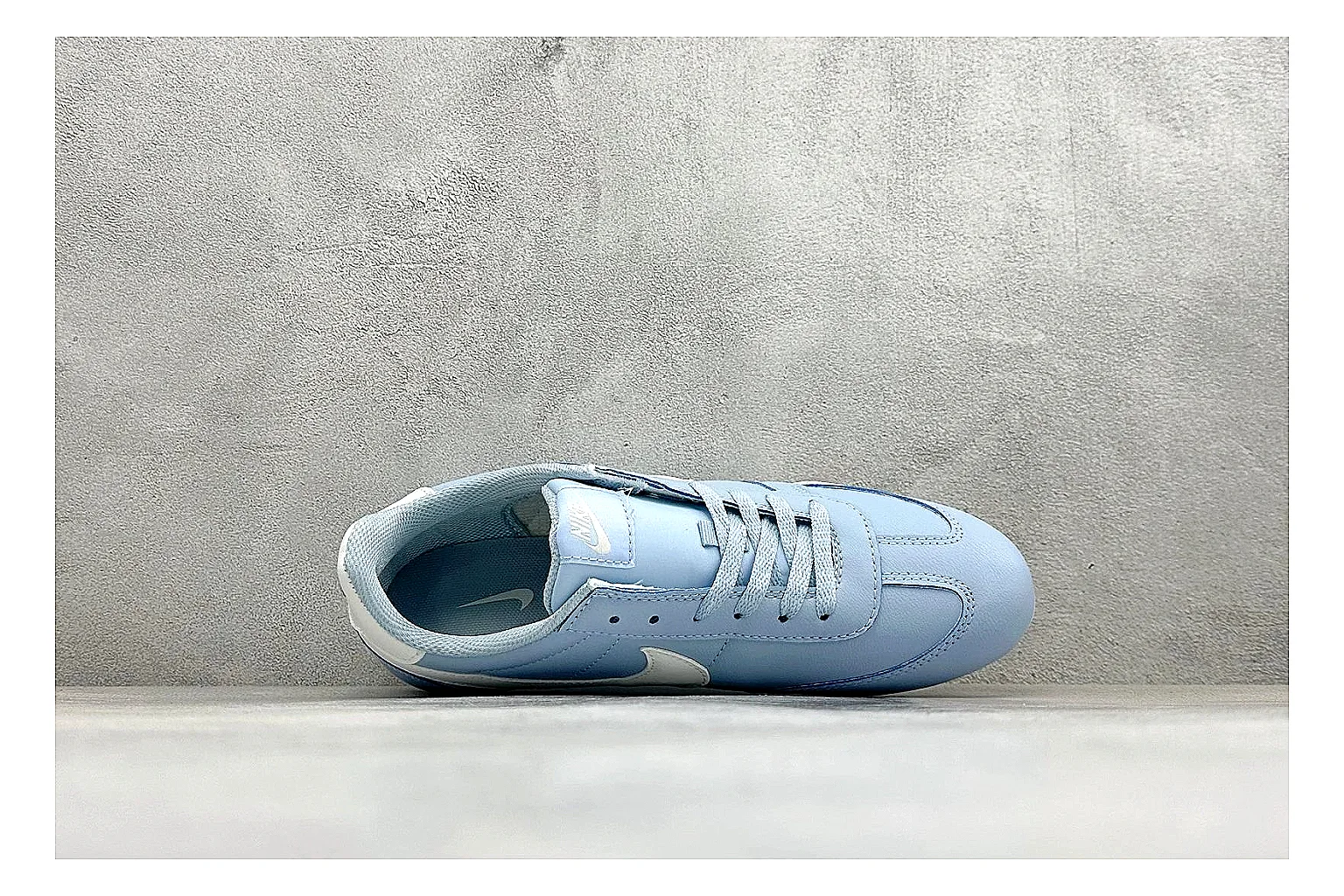 Nike Sprint Sister Light Blue comparison photo showing light blue retro-runner upper, slim side profile, tonal panels, and low everyday sole