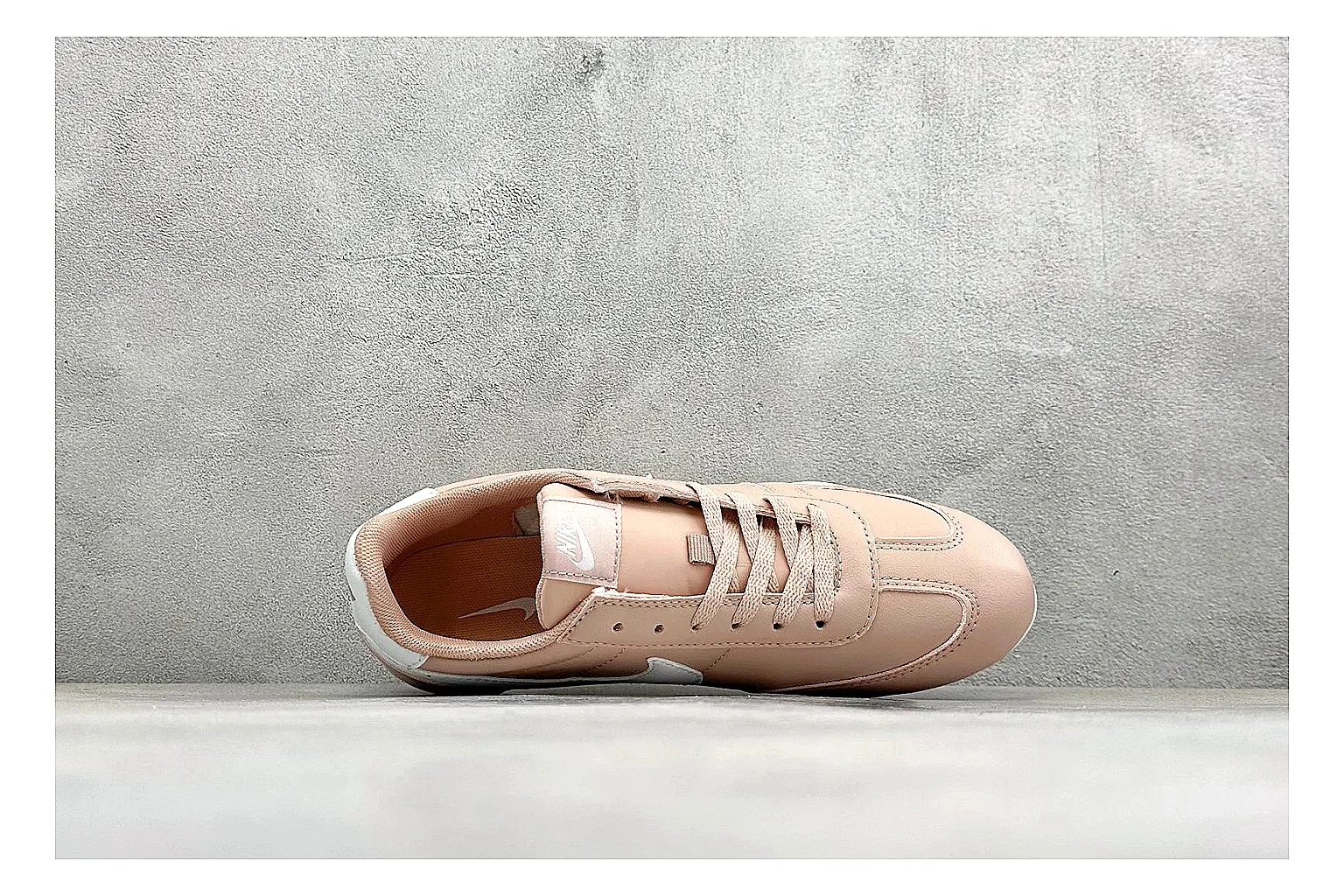 Nike Sprint Sister Pink comparison photo showing soft pink retro-runner upper, slim side profile, low collar, and light casual sole