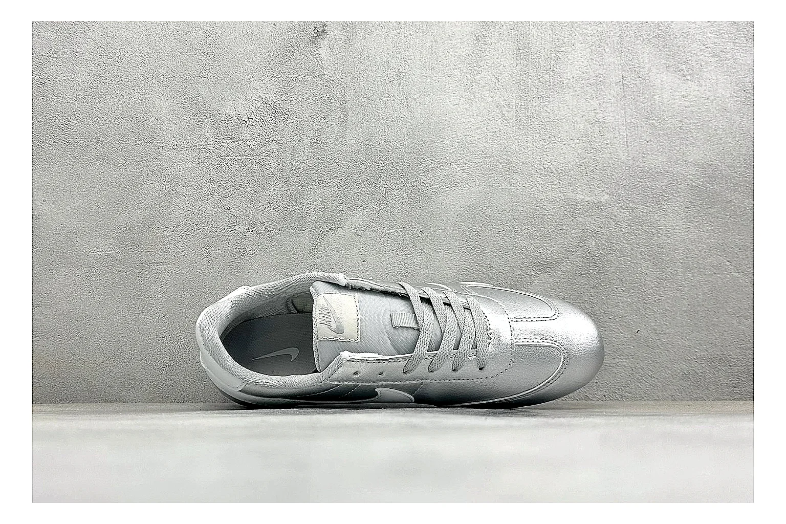 Nike Sprint Sister Silver comparison photo showing silver retro-runner upper, slim low-top shape, layered side panels, and a light everyday sole thumbnail 2