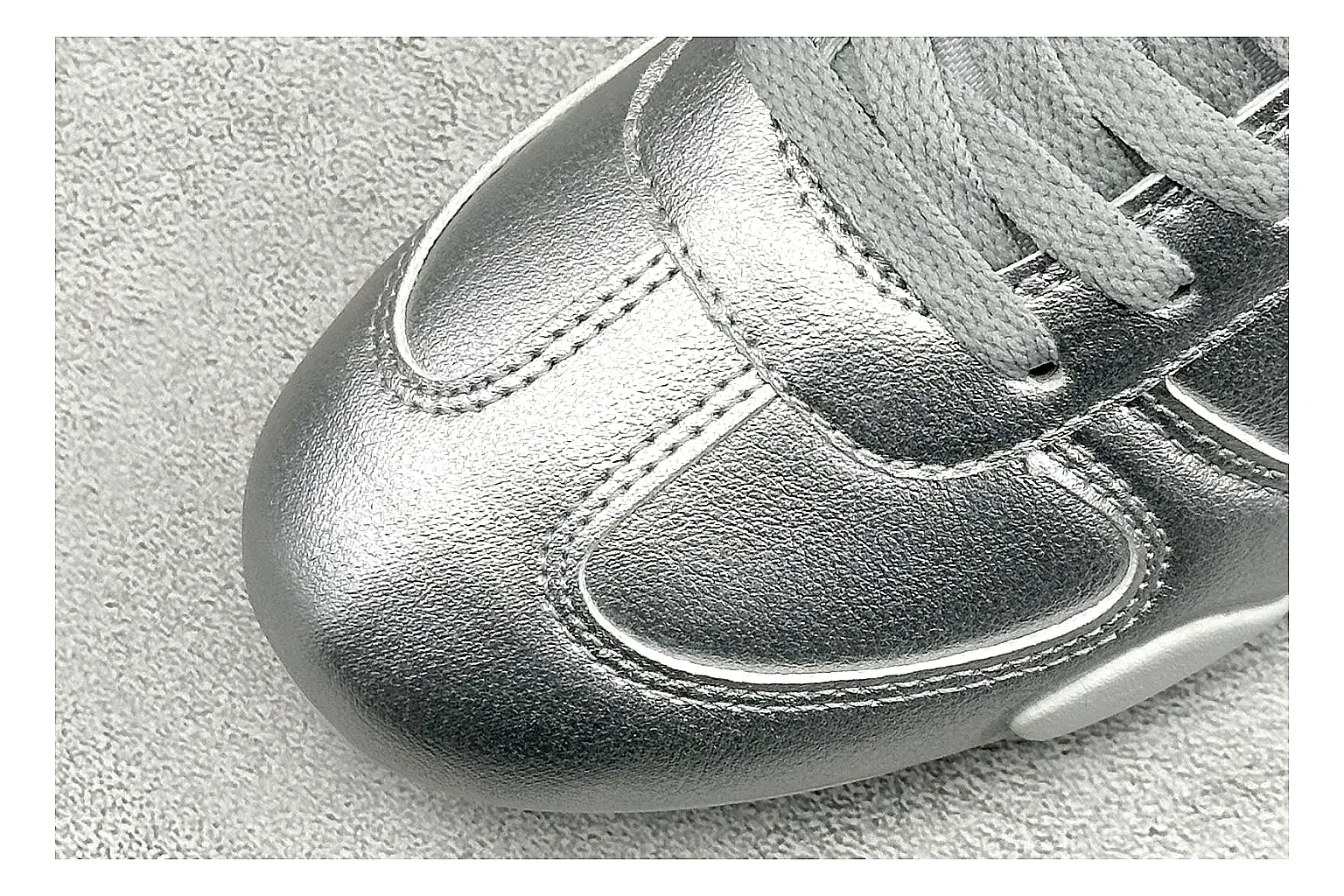 Nike Sprint Sister Silver comparison photo showing silver retro-runner upper, slim low-top shape, layered side panels, and a light everyday sole thumbnail 5