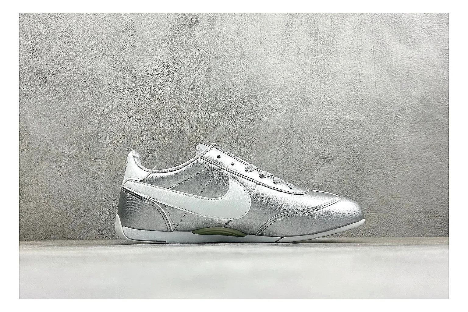 Nike Sprint Sister Silver comparison photo showing silver retro-runner upper, slim low-top shape, layered side panels, and a light everyday sole thumbnail 6