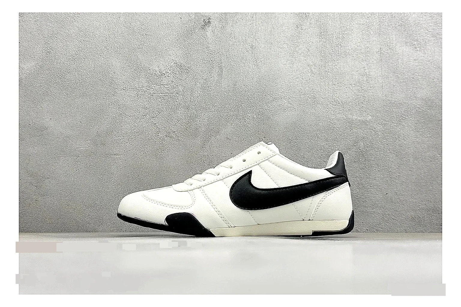 Nike Sprint Sister White Black comparison photo showing white retro-runner upper, black Swoosh contrast, slim low-top profile, and light casual sole