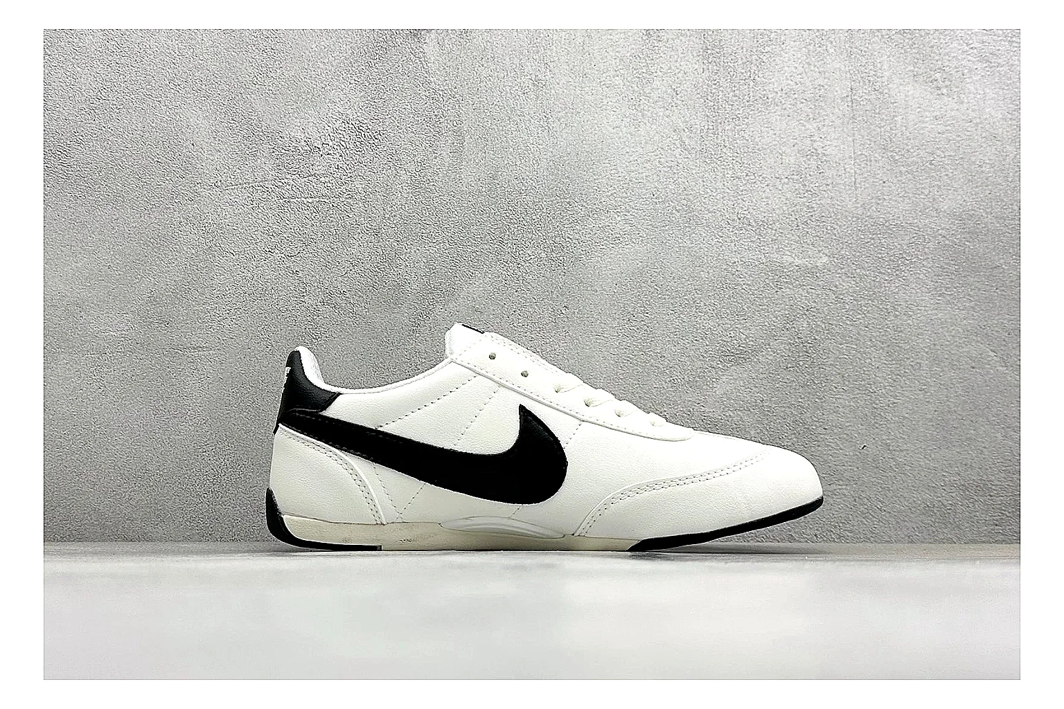 Nike Sprint Sister White Black comparison photo showing white retro-runner upper, black Swoosh contrast, slim low-top profile, and light casual sole thumbnail 6