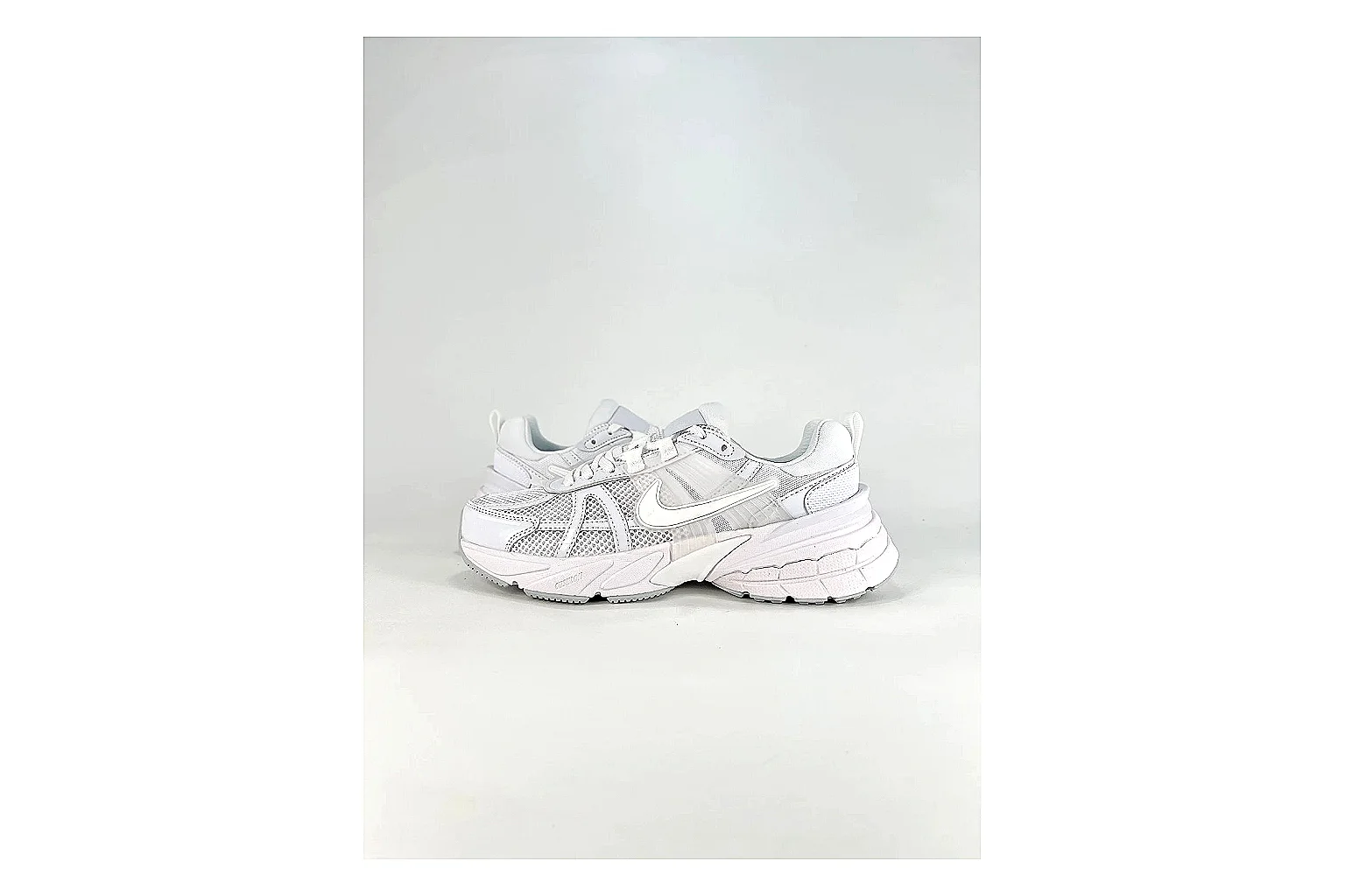 Nike V2K Run White Sneakers comparison signal photo with white retro runner sneakers with mesh-leather texture, side-profile shape, upper panel lines, and outsole detail