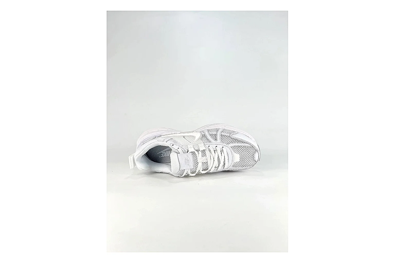 Nike V2K Run White Sneakers comparison signal photo with white retro runner sneakers with mesh-leather texture, side-profile shape, upper panel lines, and outsole detail thumbnail 2