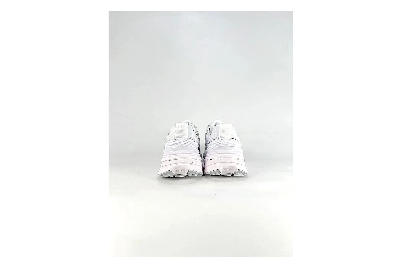 Nike V2K Run White Sneakers comparison signal photo with white retro runner sneakers with mesh-leather texture, side-profile shape, upper panel lines, and outsole detail thumbnail 3