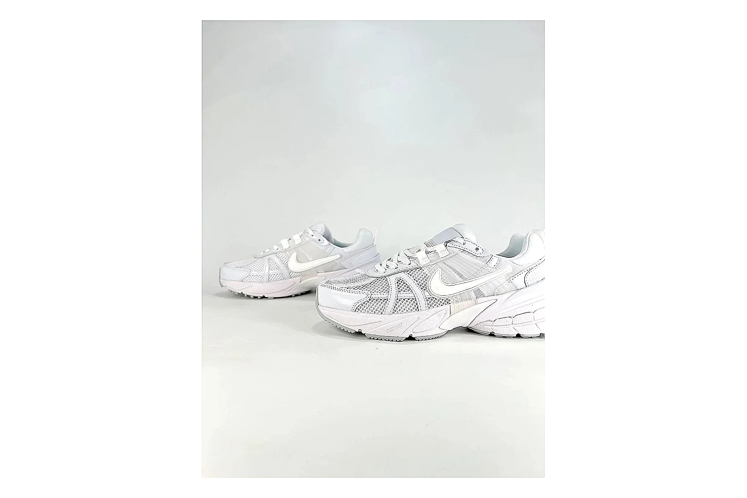 Nike V2K Run White Sneakers comparison signal photo with white retro runner sneakers with mesh-leather texture, side-profile shape, upper panel lines, and outsole detail thumbnail 5