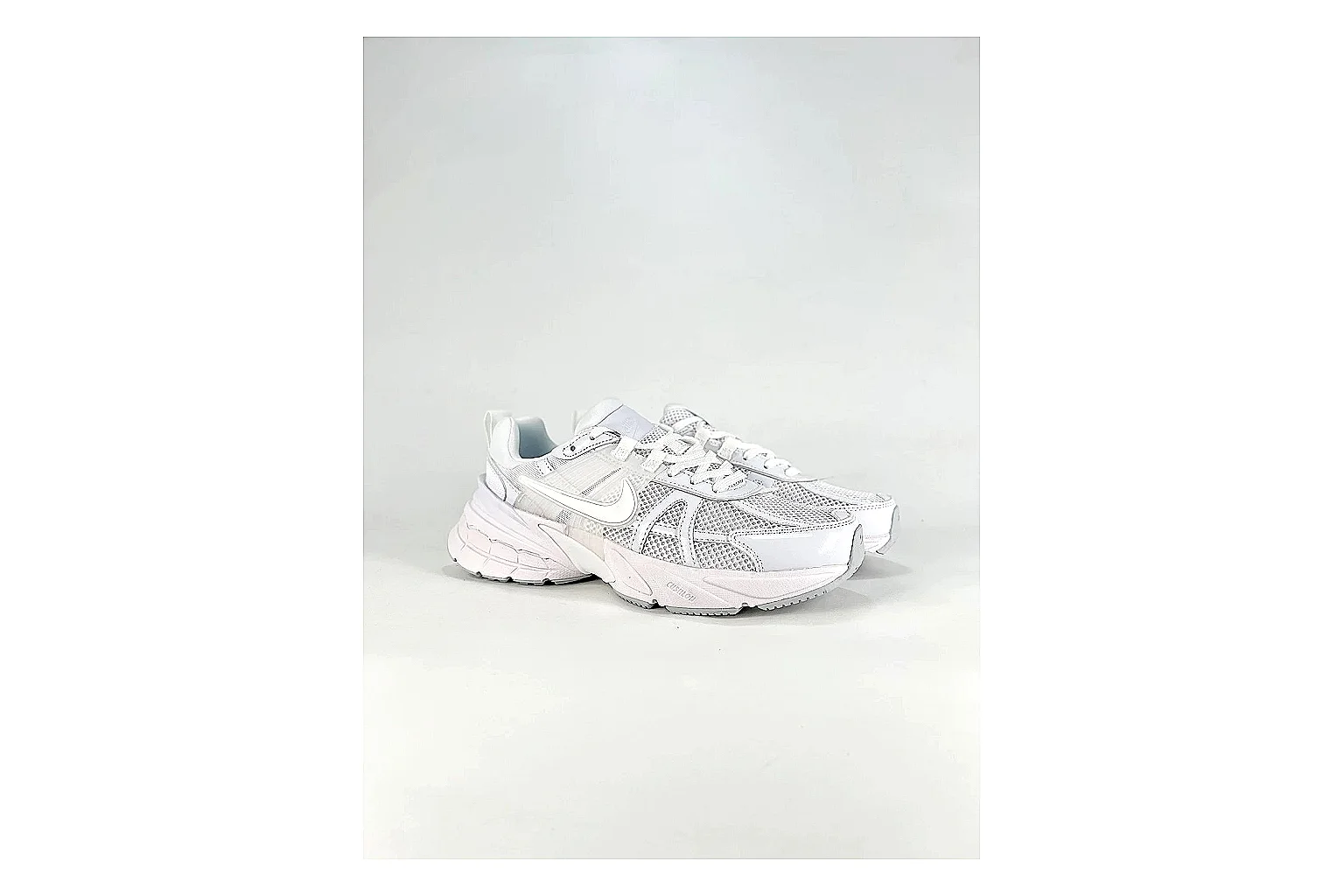 Nike V2K Run White Sneakers comparison signal photo with white retro runner sneakers with mesh-leather texture, side-profile shape, upper panel lines, and outsole detail thumbnail 6