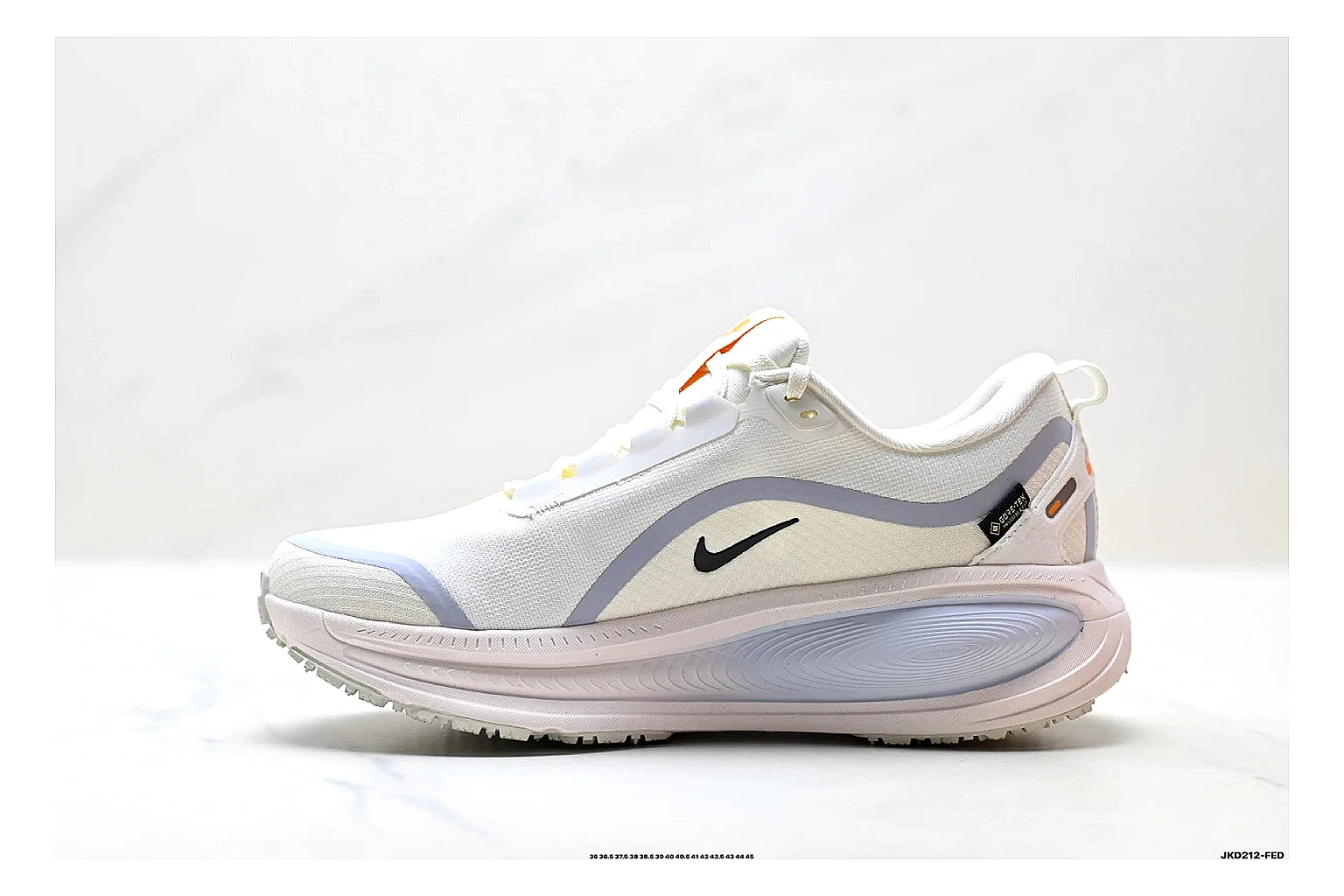 Nike Vomero White Orange comparison photo showing white mesh runner upper, orange accents, layered Vomero-style panels, and cushioned modern sole