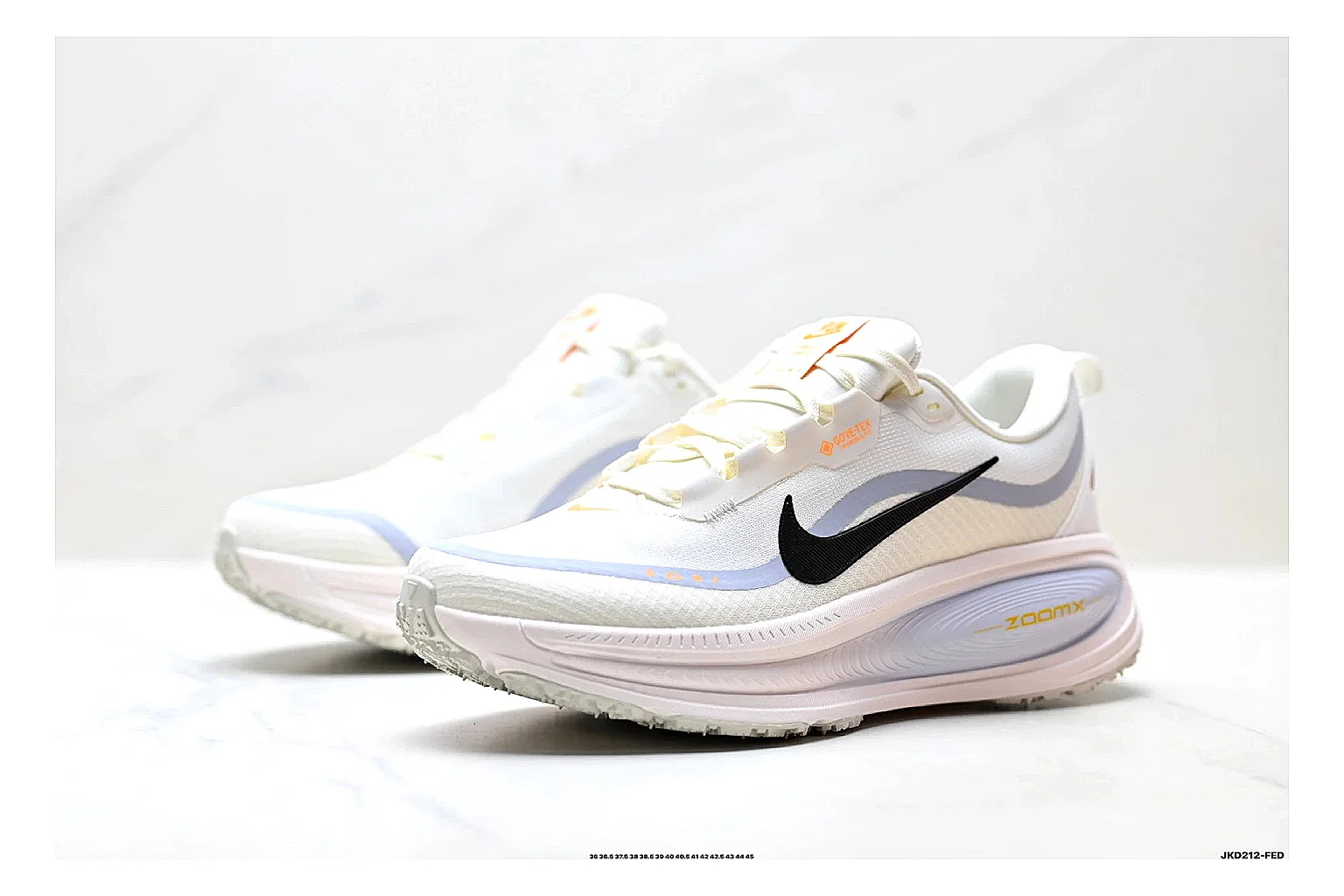Nike Vomero White Orange comparison photo showing white mesh runner upper, orange accents, layered Vomero-style panels, and cushioned modern sole thumbnail 4