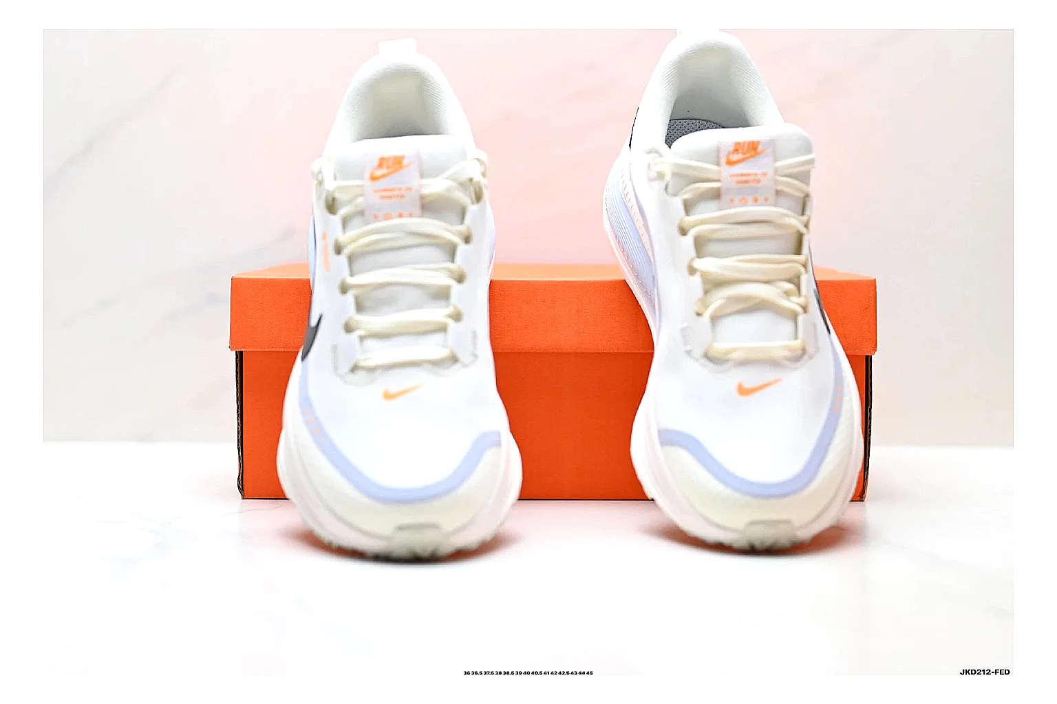 Nike Vomero White Orange comparison photo showing white mesh runner upper, orange accents, layered Vomero-style panels, and cushioned modern sole thumbnail 5