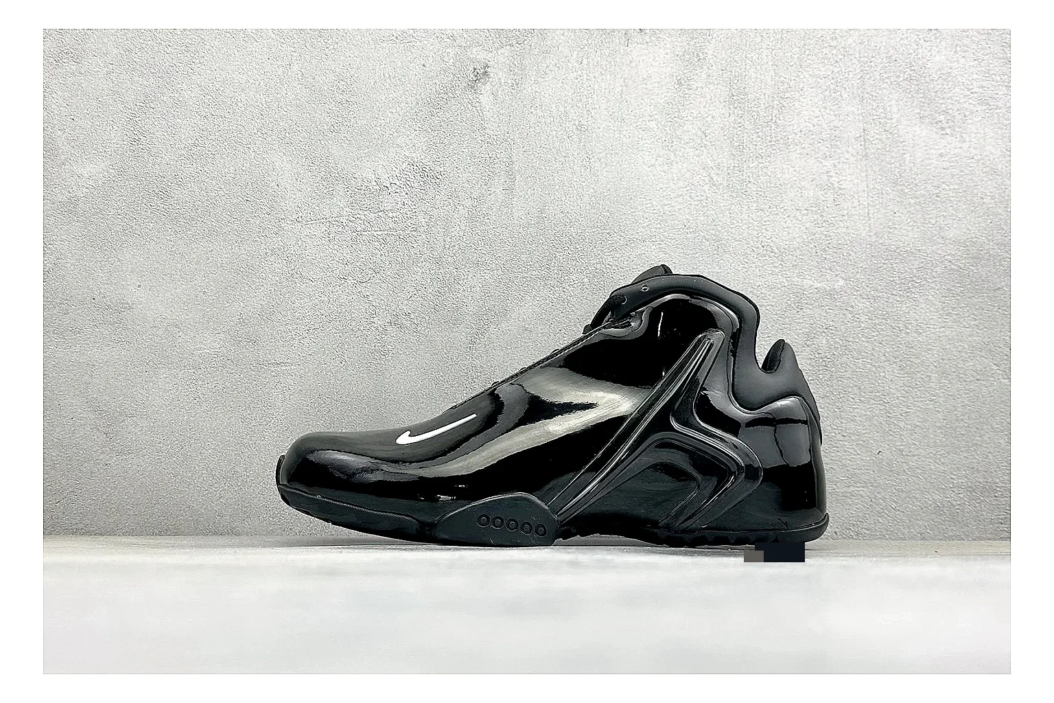 Nike Zoom Hyperflight Black comparison photo showing glossy black basketball upper, sleek shell shape, subtle Swoosh detail, and sculpted court sole