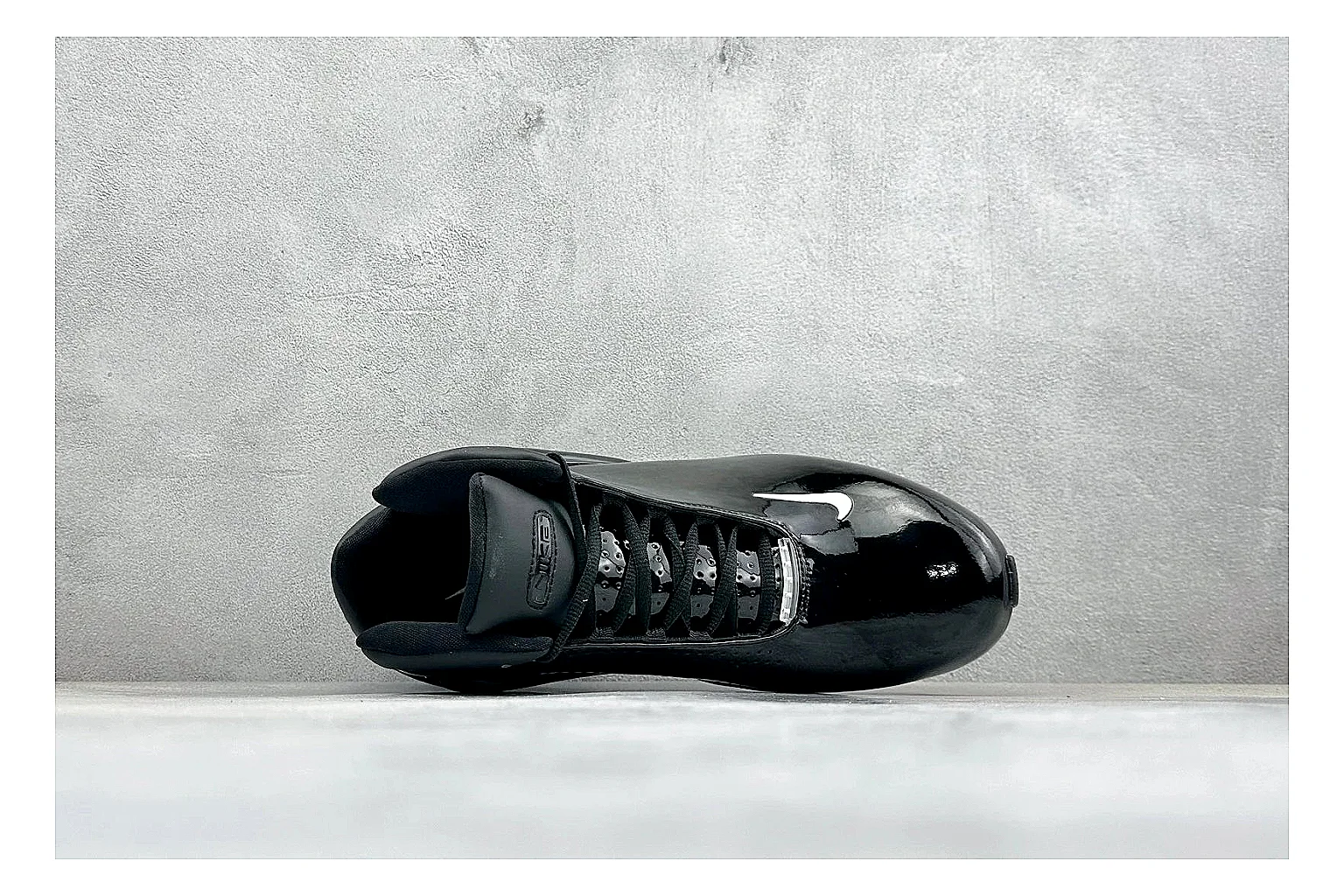 Nike Zoom Hyperflight Black comparison photo showing glossy black basketball upper, sleek shell shape, subtle Swoosh detail, and sculpted court sole thumbnail 2