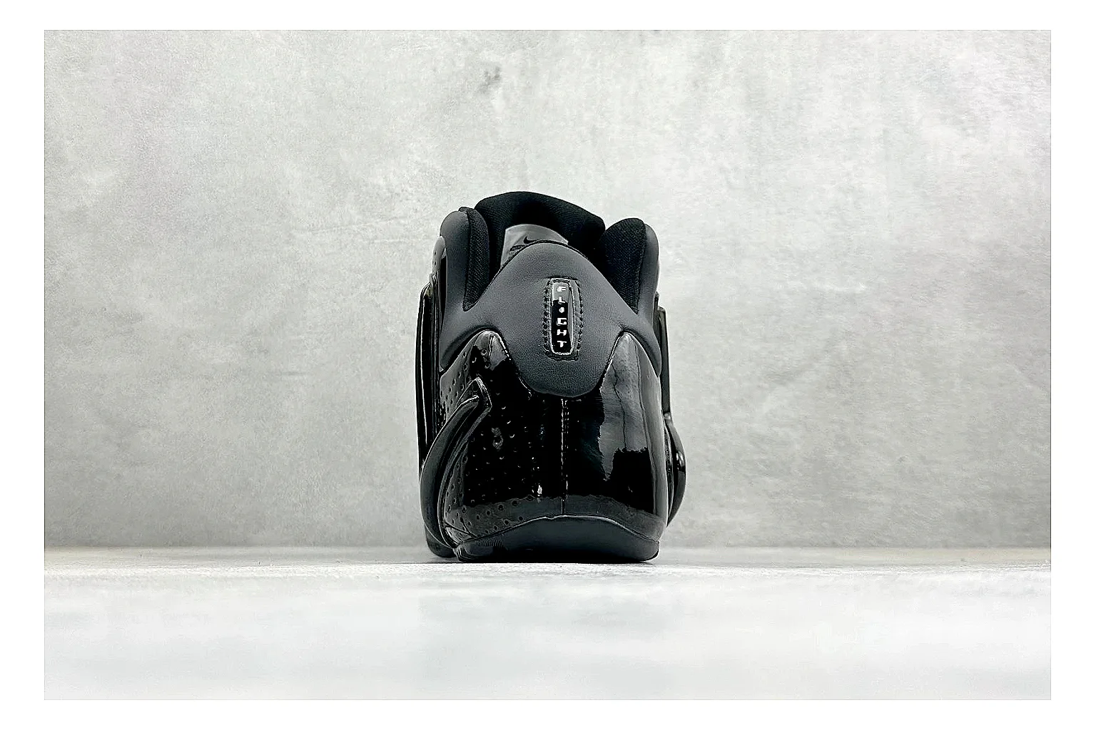 Nike Zoom Hyperflight Black comparison photo showing glossy black basketball upper, sleek shell shape, subtle Swoosh detail, and sculpted court sole thumbnail 3