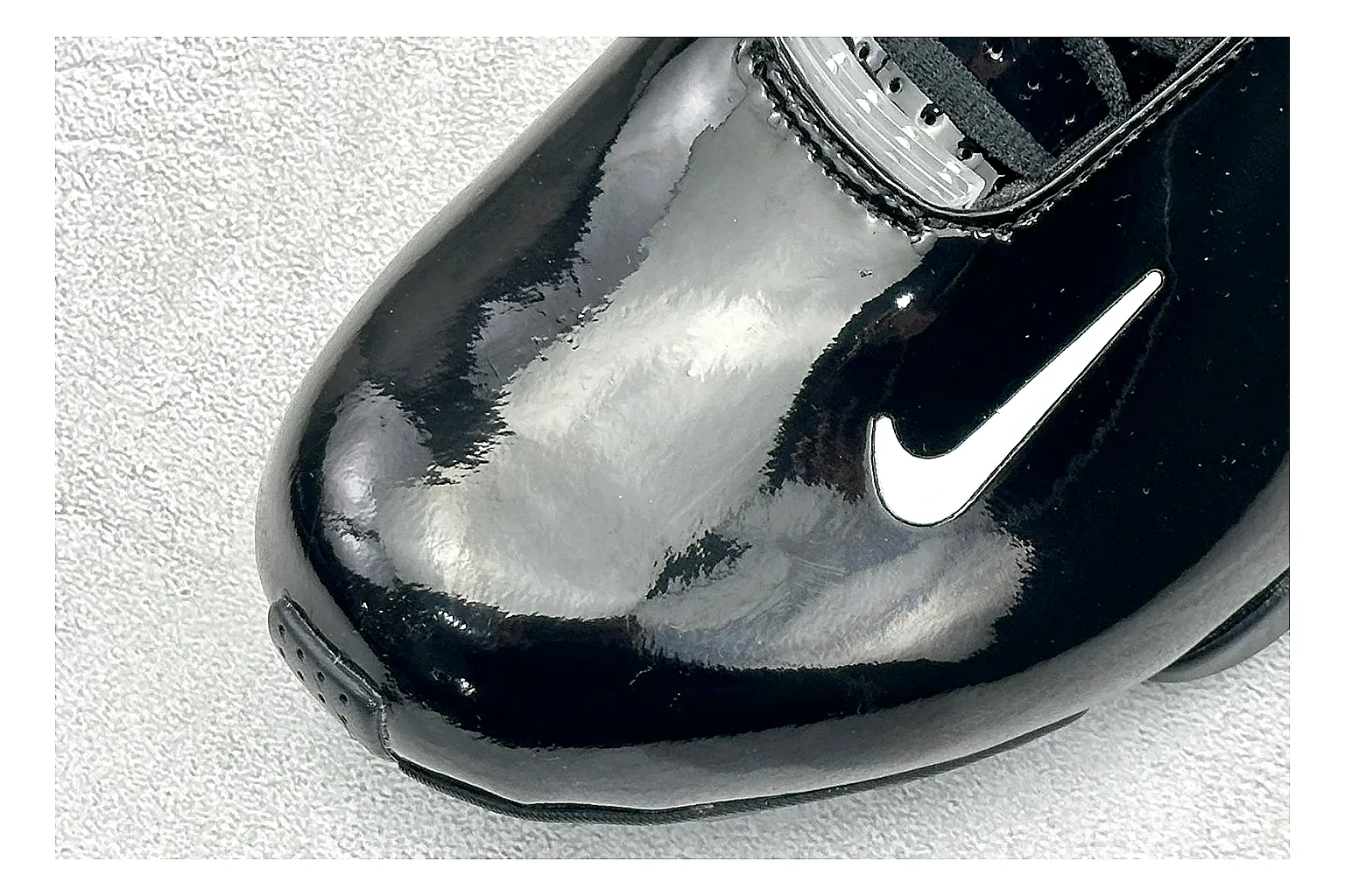 Nike Zoom Hyperflight Black comparison photo showing glossy black basketball upper, sleek shell shape, subtle Swoosh detail, and sculpted court sole thumbnail 5