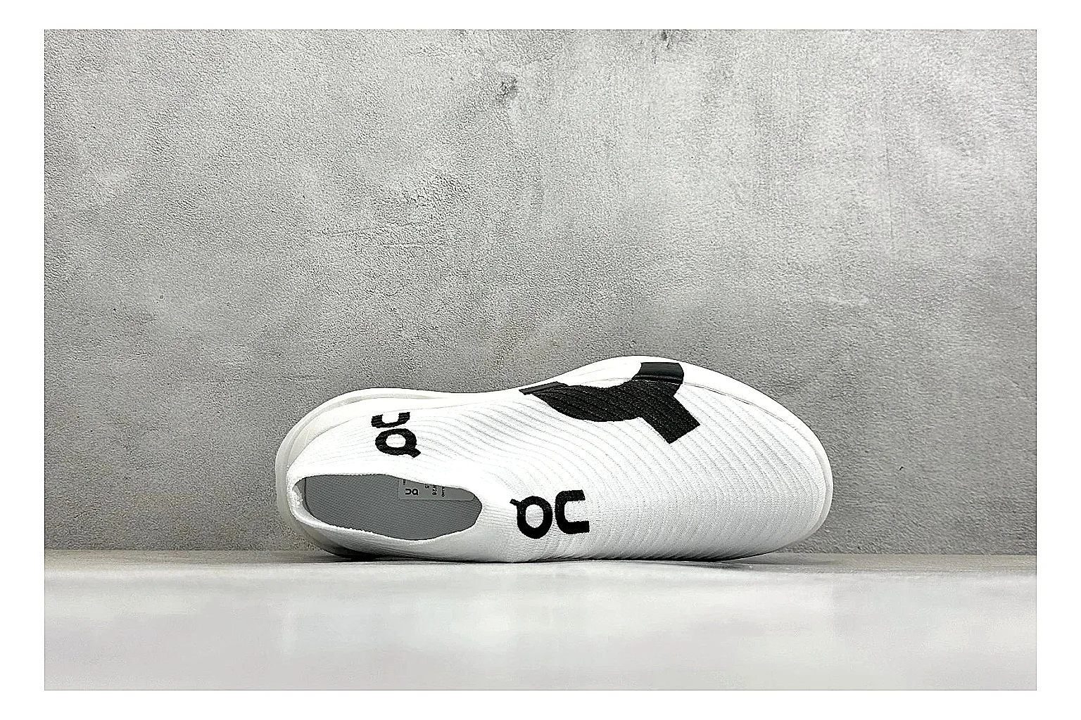 On Cloudboom White Black comparison photo showing white performance mesh, black contrast details, slim racing profile, and segmented CloudTec sole thumbnail 2
