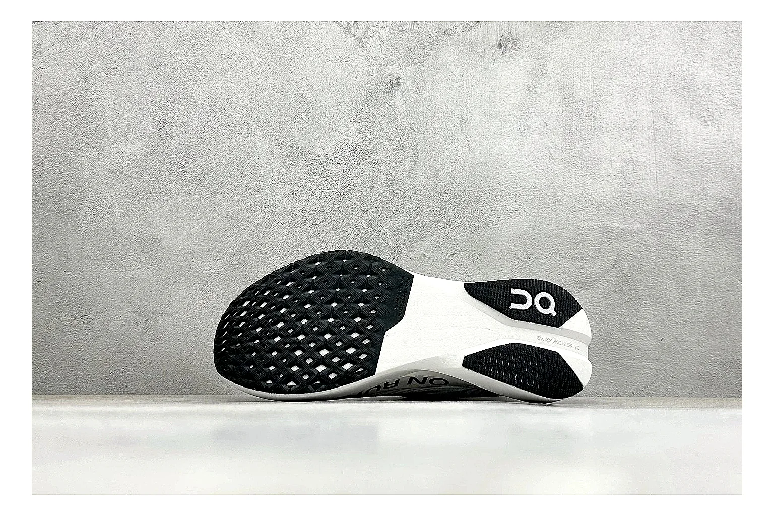 On Cloudboom White Black comparison photo showing white performance mesh, black contrast details, slim racing profile, and segmented CloudTec sole thumbnail 4