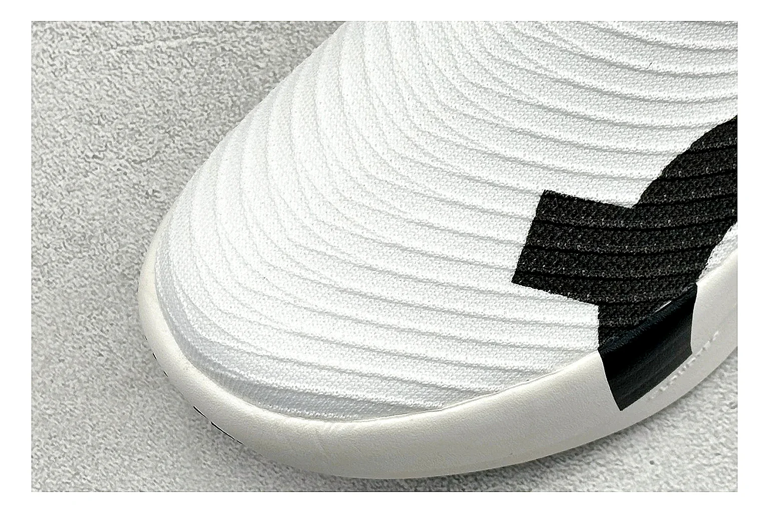 On Cloudboom White Black comparison photo showing white performance mesh, black contrast details, slim racing profile, and segmented CloudTec sole thumbnail 5