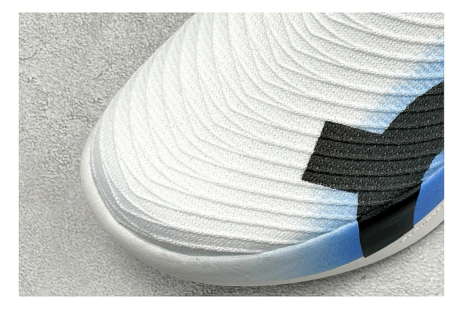 On Cloudboom White Blue comparison photo showing white performance mesh, blue gradient accents, slim racing profile, and segmented CloudTec sole thumbnail 5
