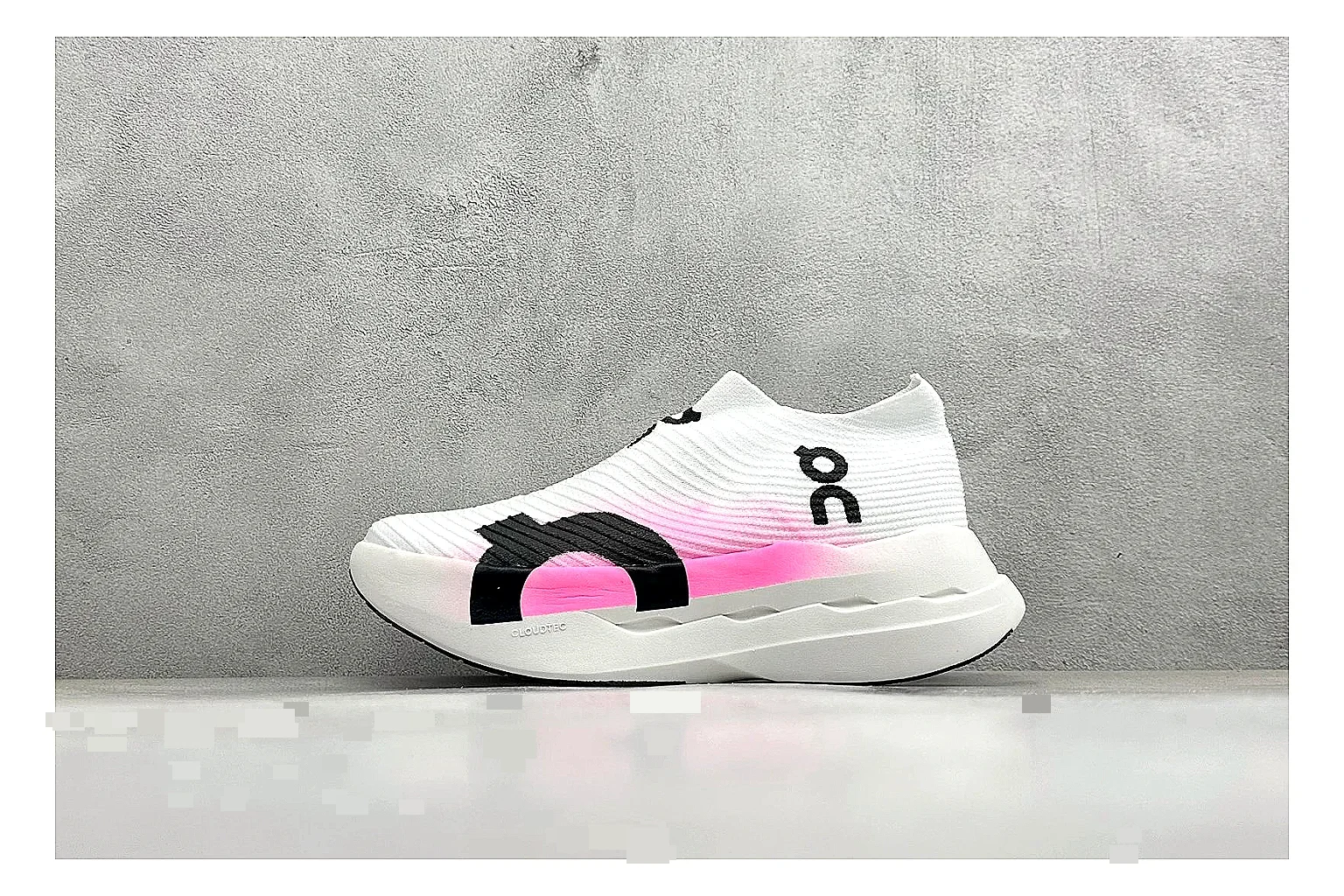 On Cloudboom White Pink comparison photo showing white running mesh, pink gradient accents, low racing shape, and segmented CloudTec sole