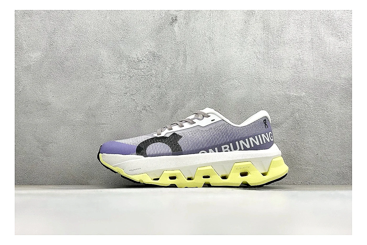 On Cloudmonster Lavender Lime comparison photo showing lavender runner upper, lime accent hits, oversized CloudTec pod sole, and soft technical color mix