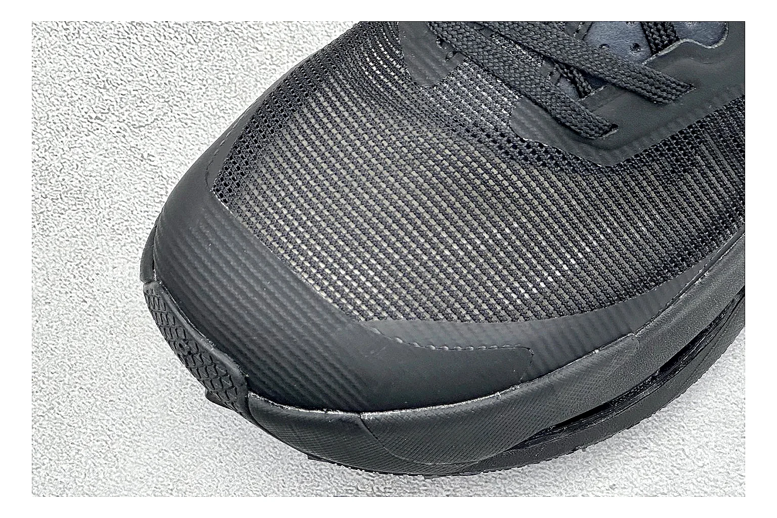On Cloudmonster Triple Black comparison photo showing triple black mesh upper, oversized CloudTec sole pods, tonal laces, and rounded runner shape thumbnail 5