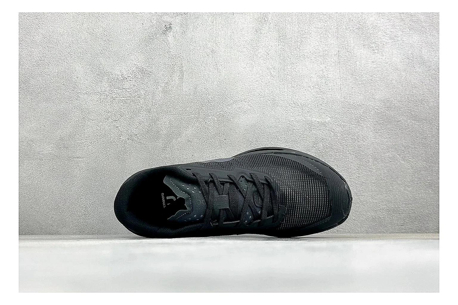 On Cloudmonster Triple Black comparison photo showing triple black running upper, oversized CloudTec pod sole, tonal laces, and rounded performance shape thumbnail 2
