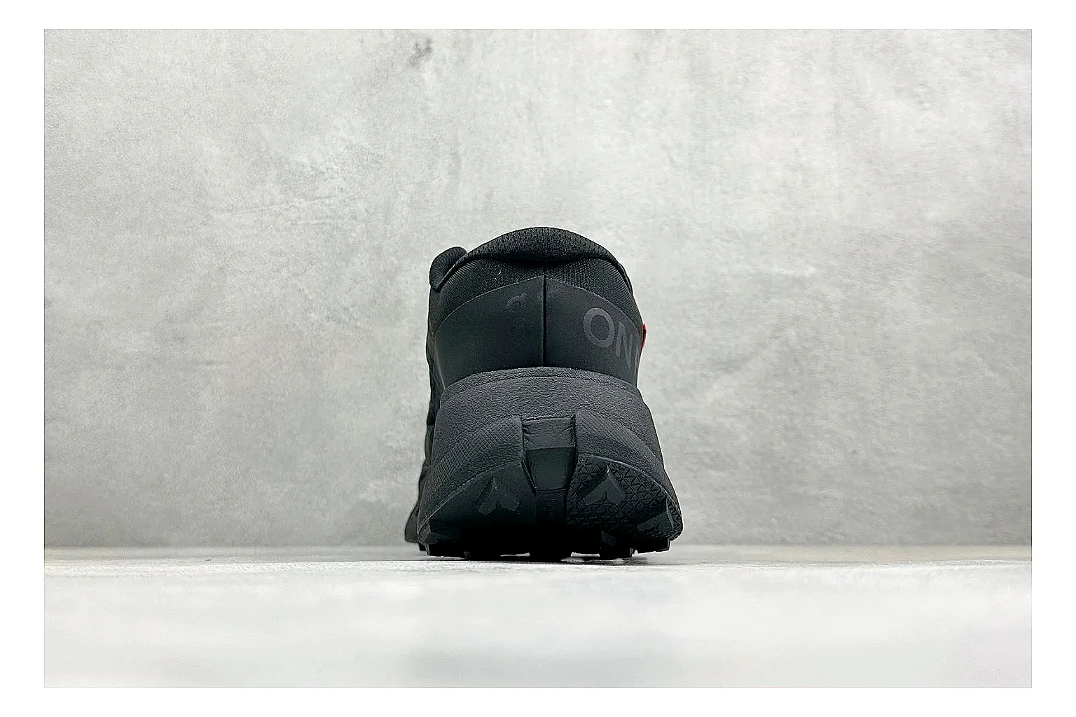 On Cloudmonster Triple Black comparison photo showing triple black running upper, oversized CloudTec pod sole, tonal laces, and rounded performance shape thumbnail 3