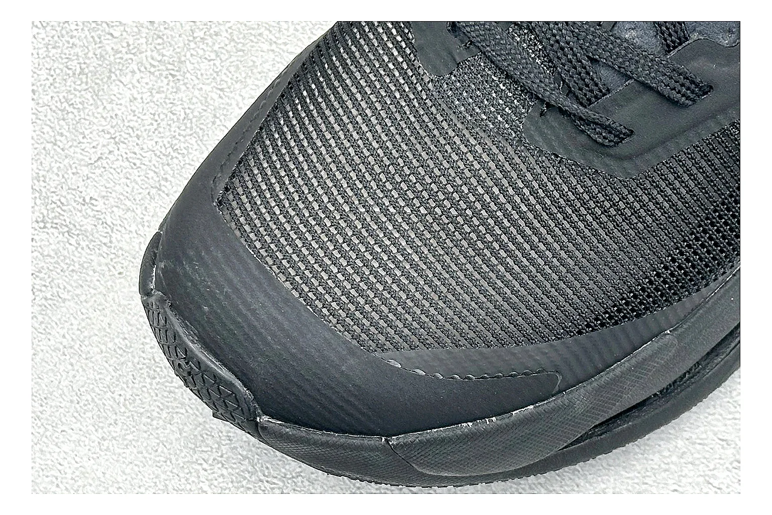 On Cloudmonster Triple Black comparison photo showing triple black running upper, oversized CloudTec pod sole, tonal laces, and rounded performance shape thumbnail 5