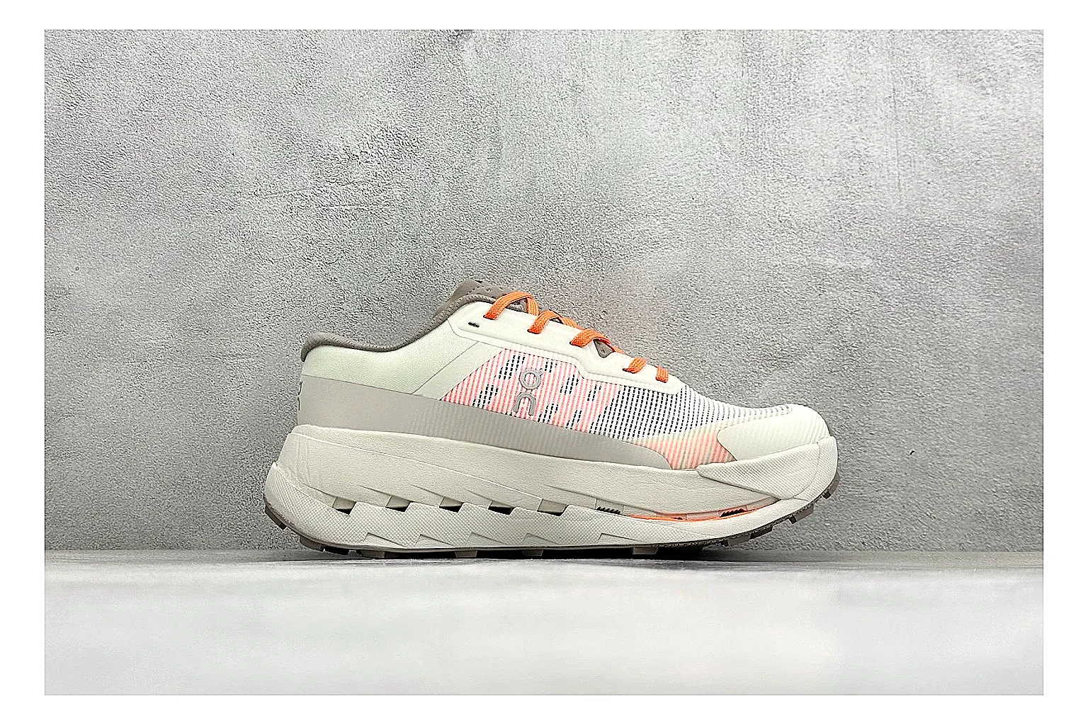 On Cloudmonster White Orange comparison photo showing white running mesh, orange accent hits, oversized CloudTec sole pods, and a rounded runner silhouette thumbnail 6
