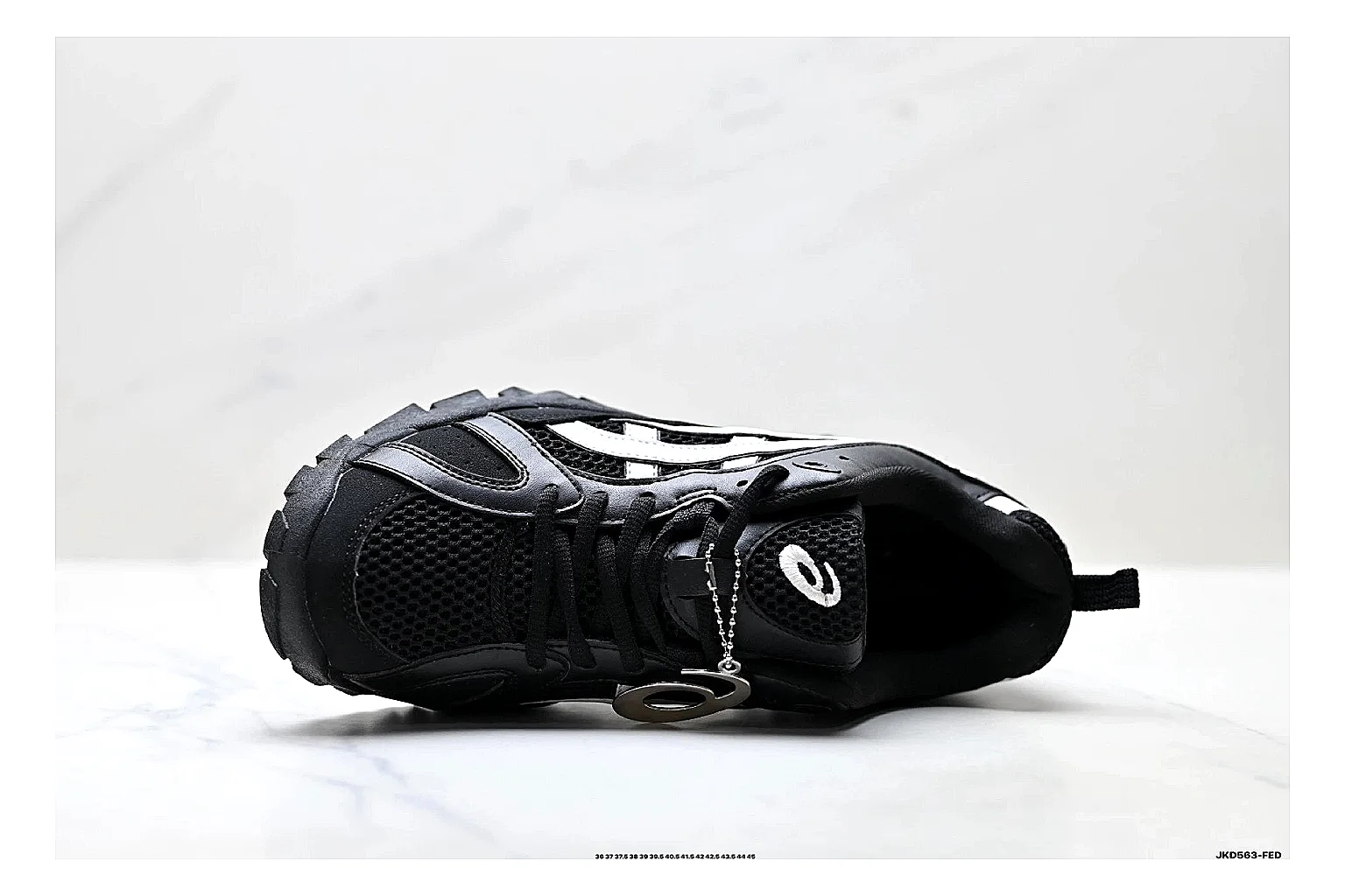 Onitsuka Tiger Gel-Tru Black White Sneakers comparison signal photo with black white trail runner sneakers with mesh-leather texture, side-profile shape, upper panel lines, and outsole detail thumbnail 2
