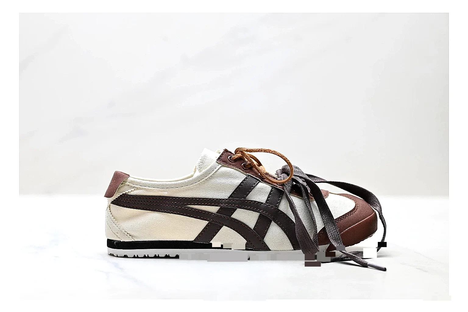 Onitsuka Tiger Mexico 66 Brown Cream Sneakers comparison signal photo with brown cream low-top sneakers with leather texture, side-profile shape, upper panel lines, and outsole detail