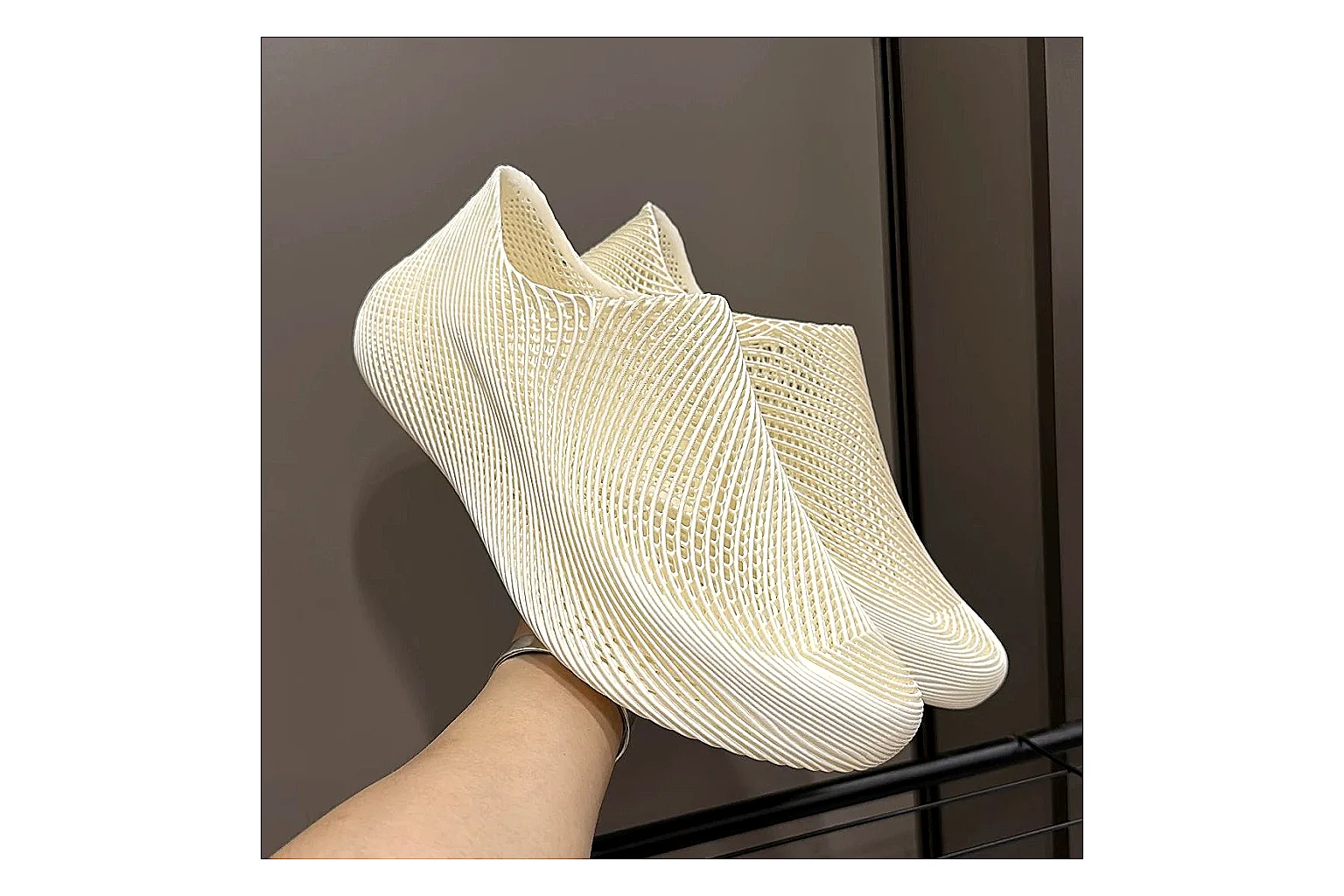 Other 4D Printed Cream Slip-On Sneakers comparison photo showing cream open-grid upper, seamless slip-on profile, sculpted sole, and soft futuristic casual shape thumbnail 2