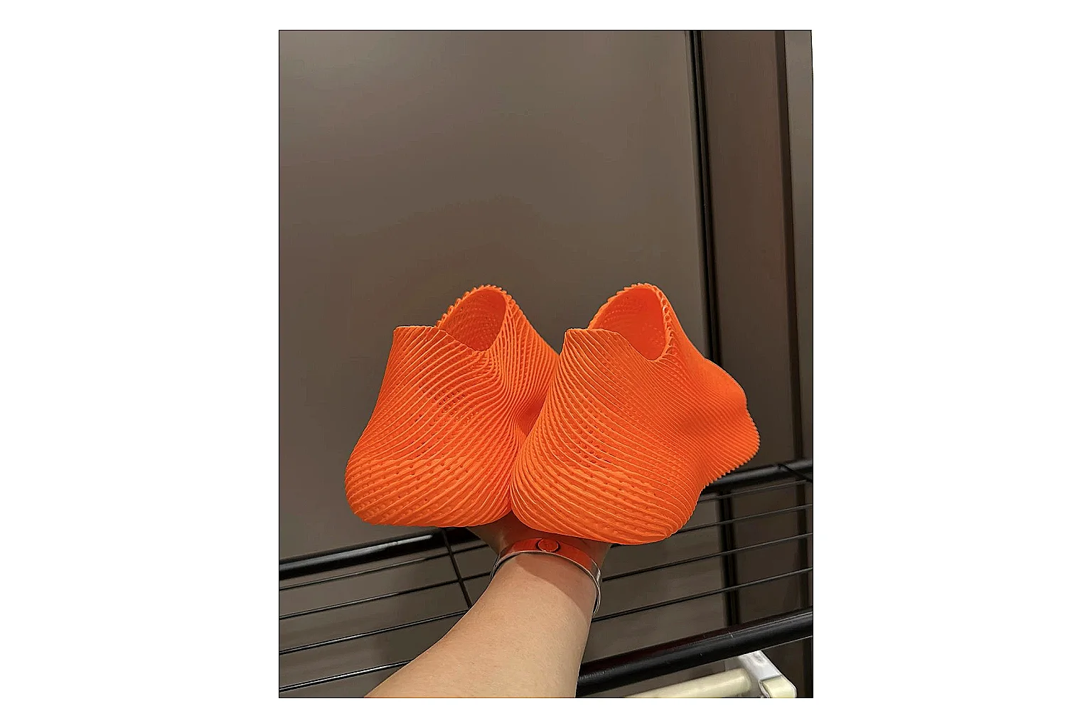 Other 4D Printed Orange Slip-On Sneakers comparison photo showing orange open-grid upper, seamless slip-on shape, sculpted sole, and futuristic lightweight profile thumbnail 4