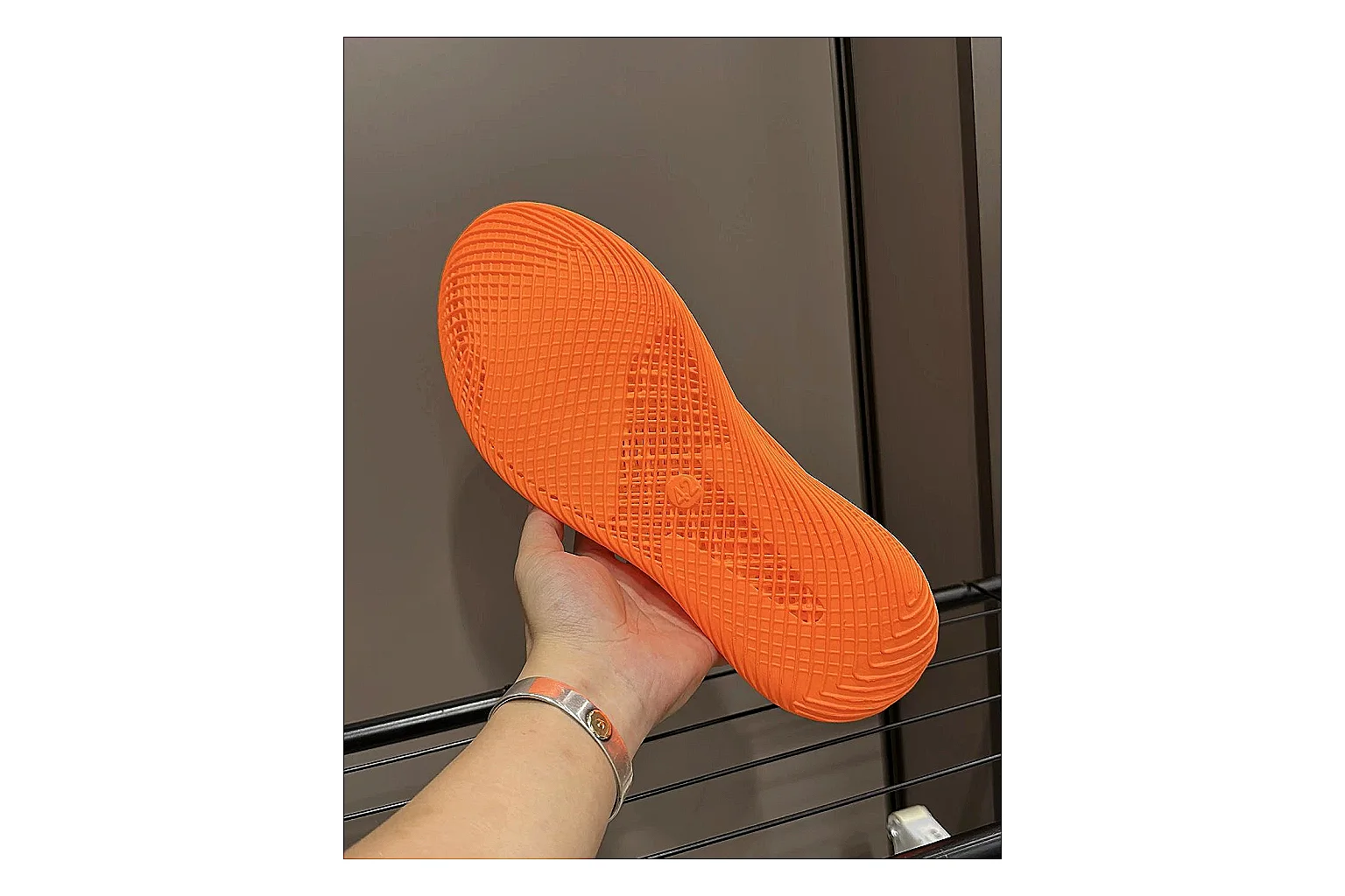 Other 4D Printed Orange Slip-On Sneakers comparison photo showing orange open-grid upper, seamless slip-on shape, sculpted sole, and futuristic lightweight profile thumbnail 5