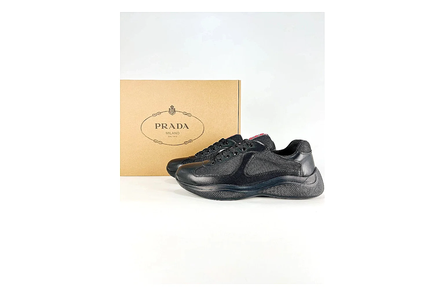 Black Runner Black Sneaker comparison photo showing black mesh runner upper, tonal overlays, modern running shape, and dark cushioned sole