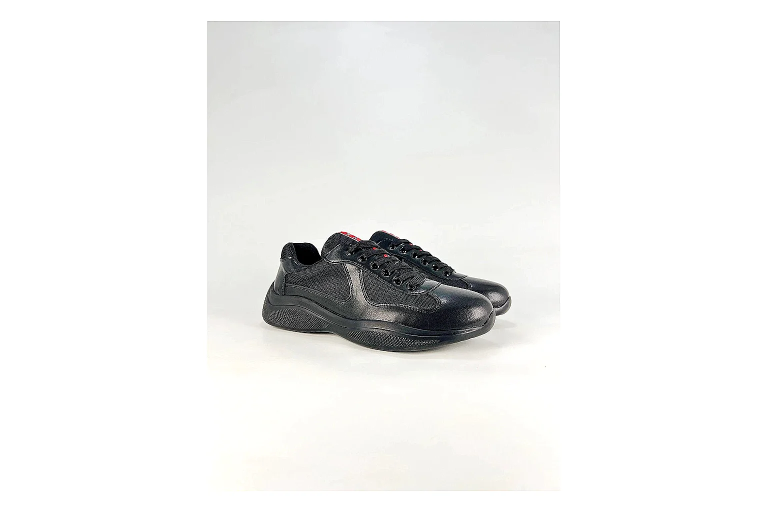 Black Runner Black Sneaker comparison photo showing black mesh runner upper, tonal overlays, modern running shape, and dark cushioned sole thumbnail 2
